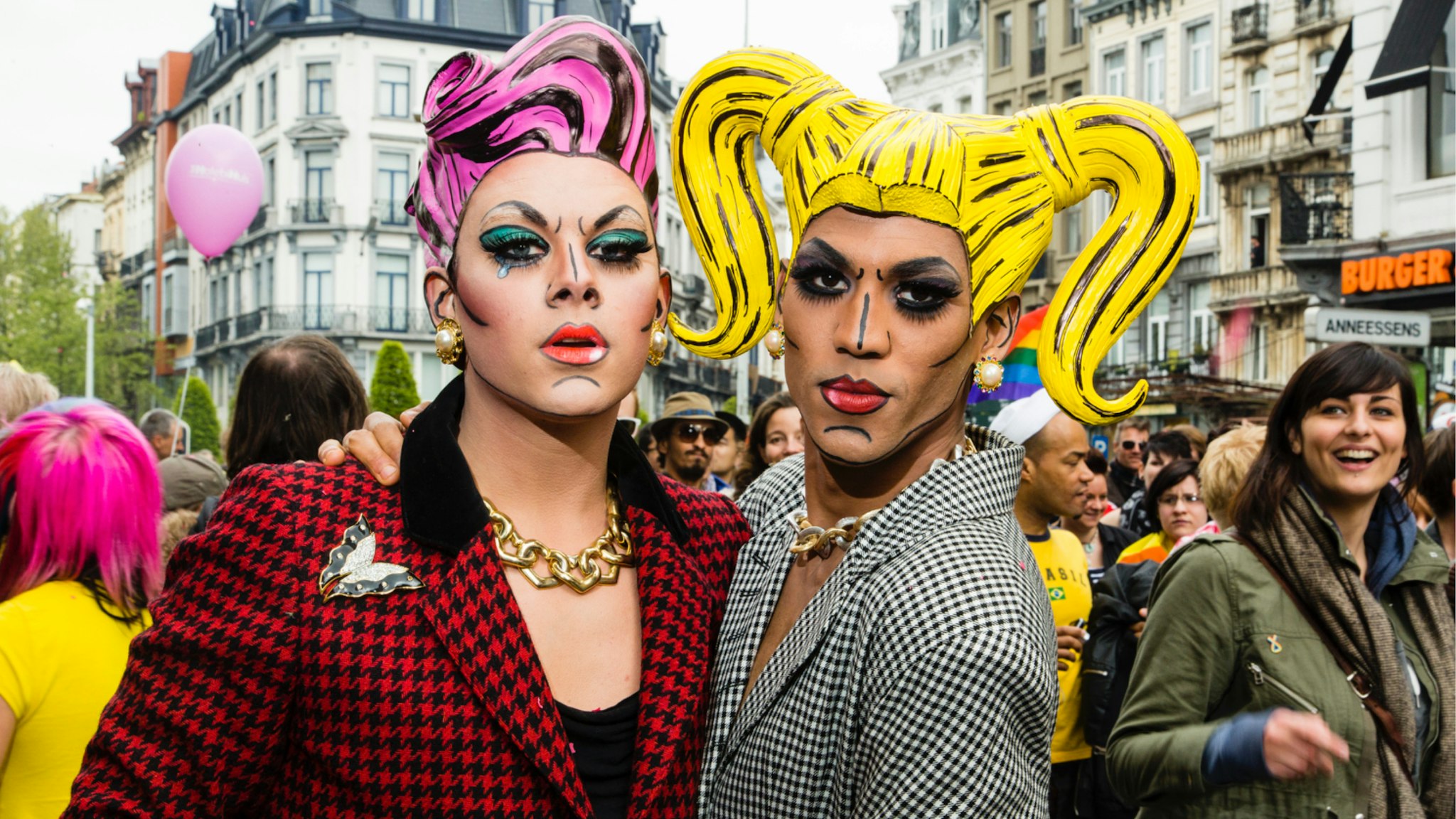 Two dressed up gay men pose in the streets of Brussels. About 80,000 participants at the Belgian Pride Parade to celebrate the LGBT (Lesbian, gay, bisexual, transgender) community and demand equal rights.