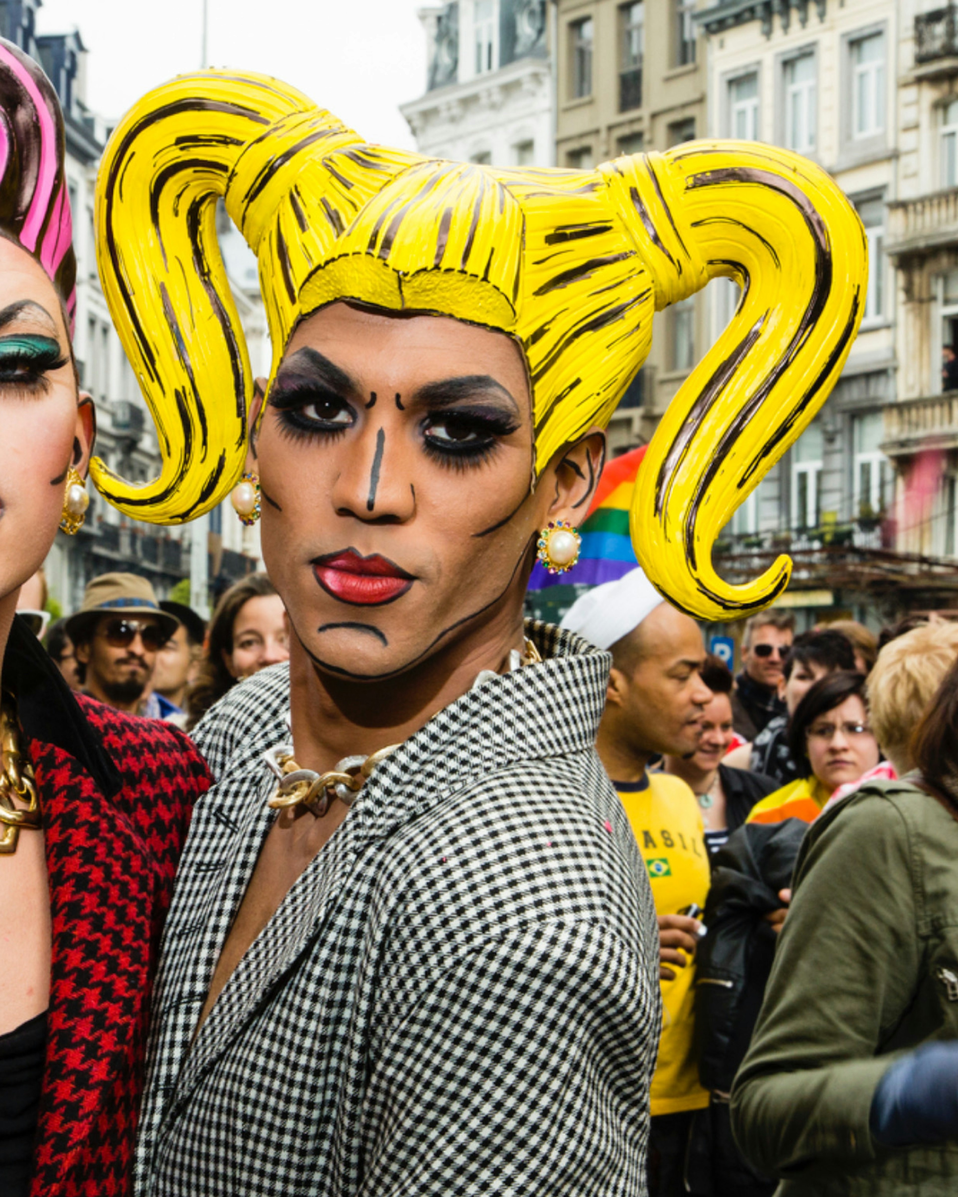Two dressed up gay men pose in the streets of Brussels. About 80,000 participants at the Belgian Pride Parade to celebrate the LGBT (Lesbian, gay, bisexual, transgender) community and demand equal rights.