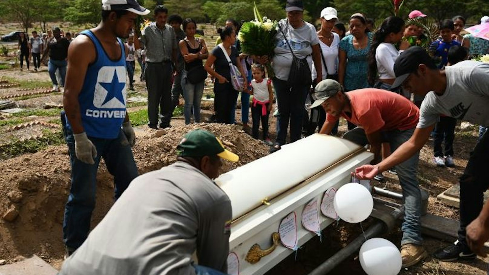 Family and friends attend the funeral of Erick Altuve a boy Venezuelan of 11, who died of cancer on May 26, in Caracas,on May 30, 2019. - Erick Altuve died of cancer while waiting to receive a bone marrow transplant at the Jose Manuel de los Rios Hospital, the main public pediatric hospital in Venezuela.