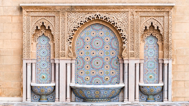 Water fountain with zelige intricate pattern of tiles in classic islamic style on the outside of Mosque Hassan in Rabat, Morocco
