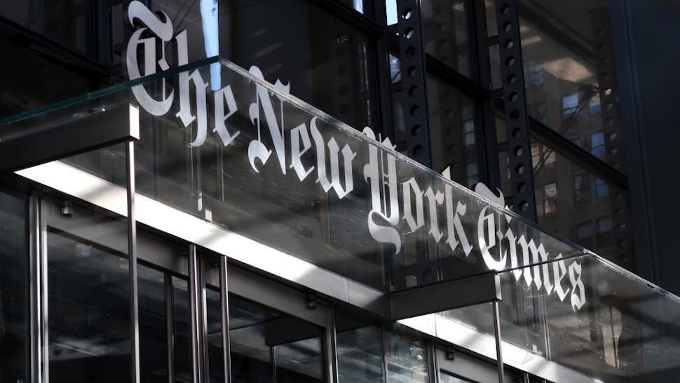 New York Times Headquarters in New York City NEW YORK, NY - OCTOBER 23: The corporate logo of the New York Times hangs above the front door of their headquarters on October 23, 2018 in New York City.