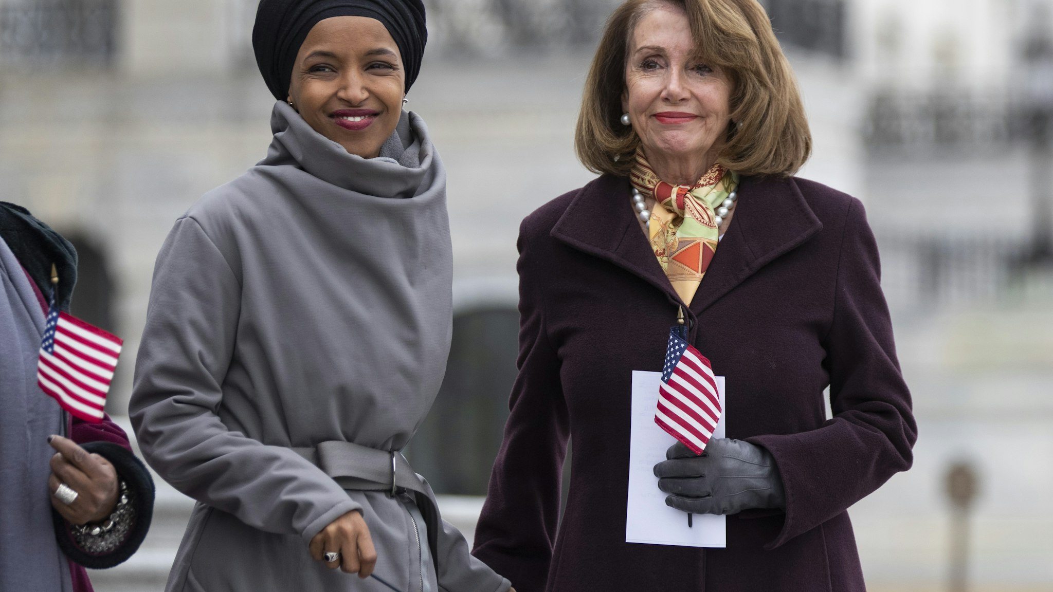 U.S. House Speaker Nancy Pelosi, a Democrat from California, right, and Representative Ilhan Omar, a Democrat from Minnesota, smile during a news conference in Washington, D.C., U.S., on Friday, March 8, 2019. House Democrats are set to approve H.R. 1, a far-reaching elections and ethics bill that would change the way congressional elections are funded, impose new voter-access mandates on states, require groups to publicize donors and force disclosure of presidential candidates' tax returns. Photographer: Alex Edelman/Bloomberg via Getty Images
