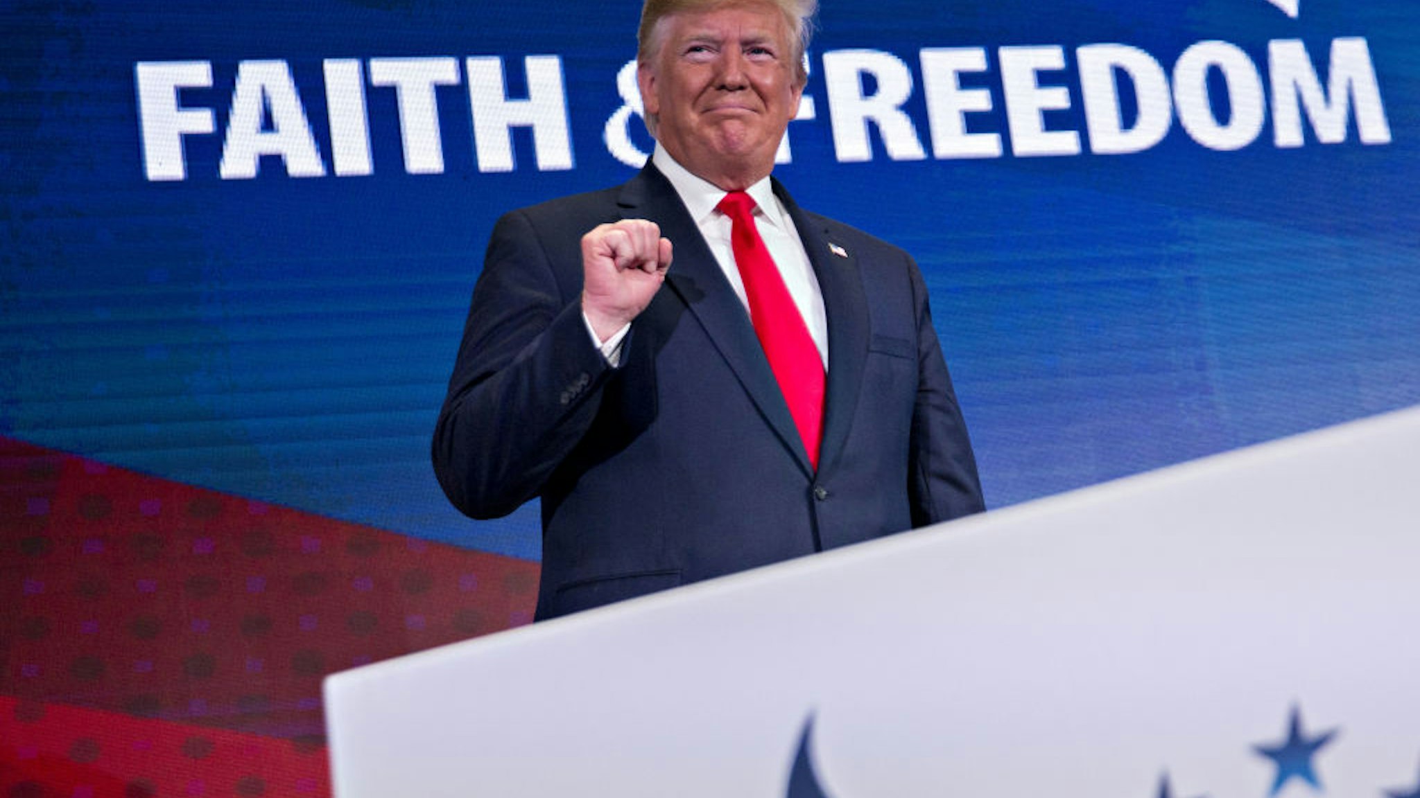 U.S. President Donald Trump gestures while arriving to speak during the Faith and Freedom Coalition's Road to Majority conference in Washington, D.C., U.S., on Wednesday, June 26, 2019.