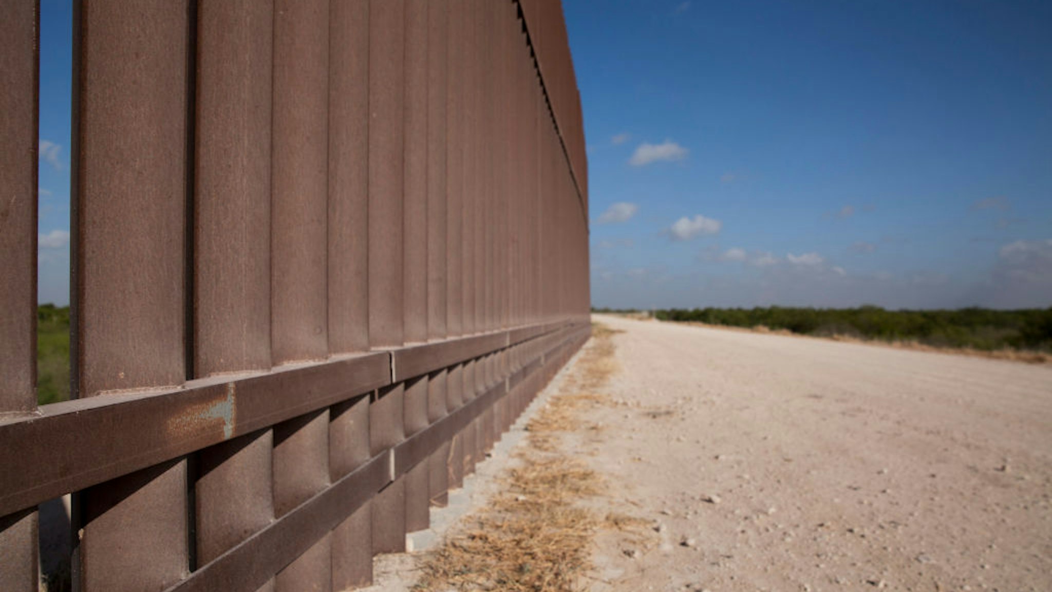 A section of the border wall stretches through the Rio Grande Valley sector of the Texas border on Aug. 20, 2019.