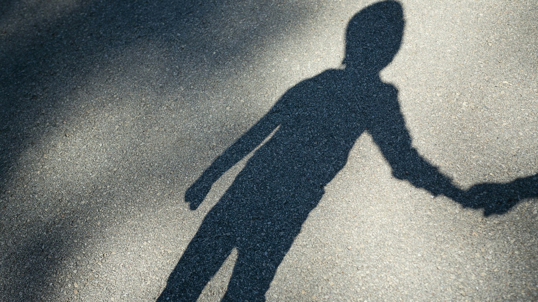 Shadow of a boy - stock photo