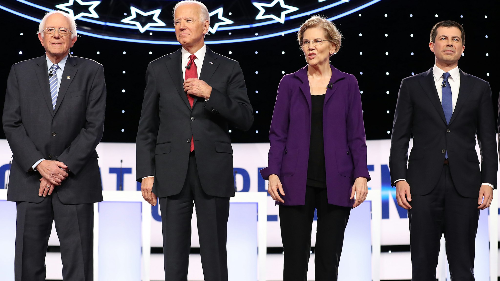 WESTERVILLE, OHIO - OCTOBER 15: Democratic presidential candidates (L-R) Sen. Bernie Sanders (I-VT), former Vice President Joe Biden, Sen. Elizabeth Warren (D-MA) and South Bend, Indiana Mayor Pete Buttigieg at the start of the Democratic Presidential Debate at Otterbein University on October 15, 2019 in Westerville, Ohio. A record 12 presidential hopefuls are participating in the debate hosted by CNN and The New York Times. (Photo by Chip Somodevilla/Getty Images)