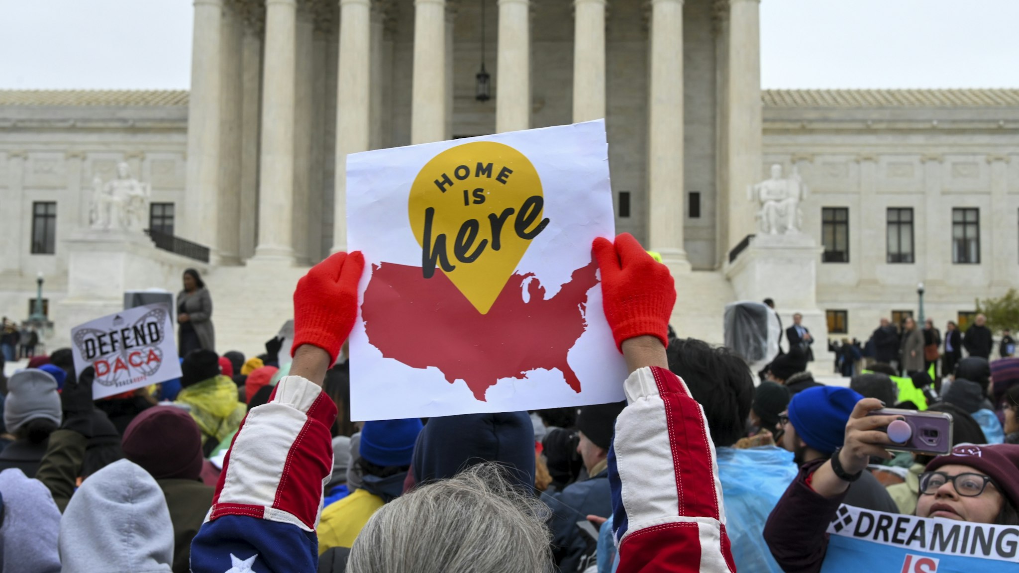 WASHINGTON, DC - NOVEMBER 12: Demonstrators gather in front of the United States Supreme Court, where the Court is hearing arguments on Deferred Action for Childhood Arrivals - DACA - that could impact the fates of nearly 700,000 "dreamers" brought to the United States as undocumented children, on Tuesday, November 12, 2019, in Washington, DC. The Donald Trump administration has tried for more than two years to wind down the Deferred Action for Childhood Arrivals (DACA) program, announced by President Barack Obama in 2012 to protect from deportation qualified young immigrants who came to the country illegally. (Photo by Jahi Chikwendiu/The Washington Post via Getty Images)