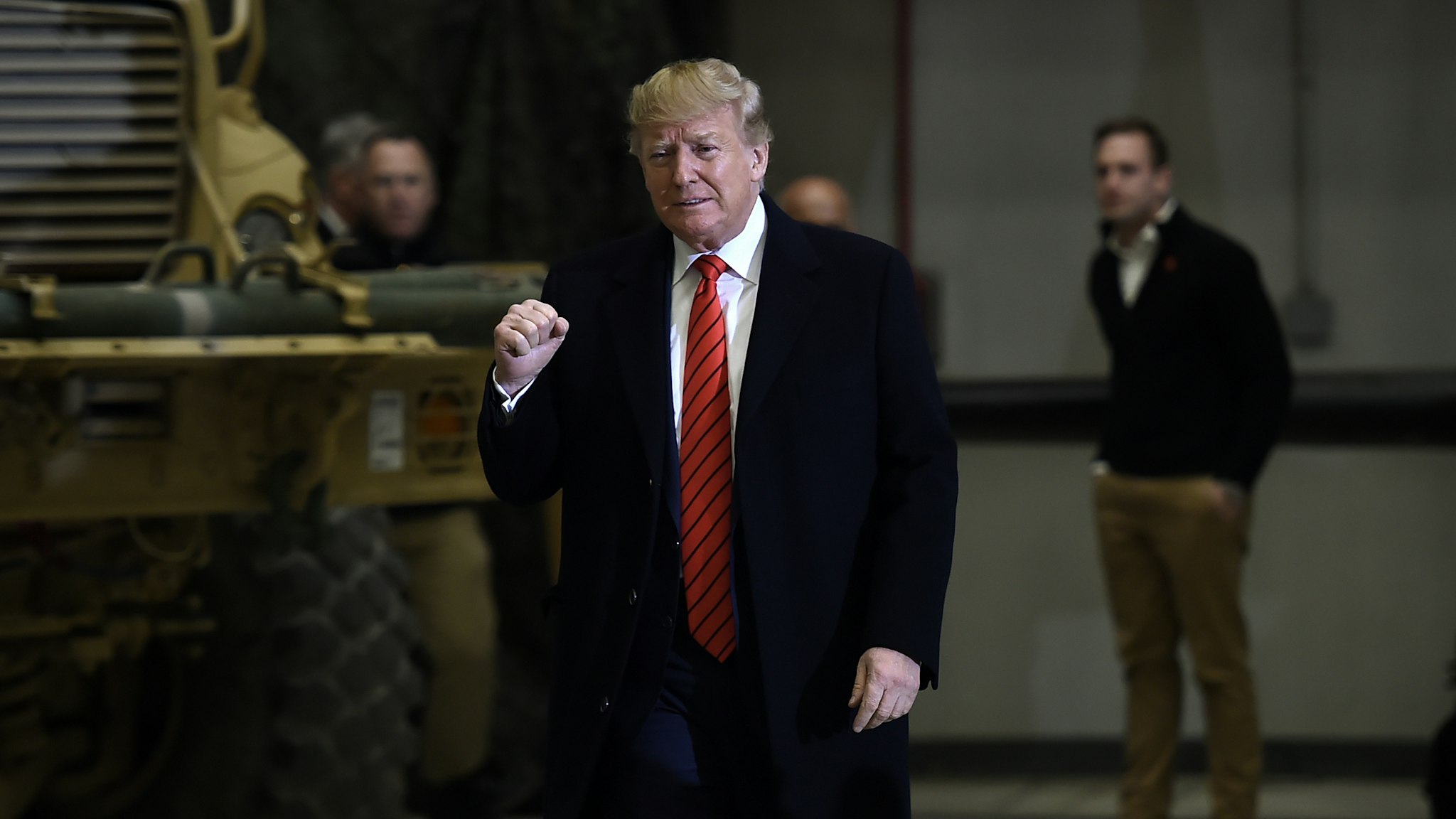 US President Donald Trump gestures as he arrives to speak to the US soldiers during a surprise Thanksgiving day visit at Bagram Air Field, on November 28, 2019 in Afghanistan. (Photo by Olivier Douliery / AFP) (Photo by OLIVIER DOULIERY/AFP via Getty Images)