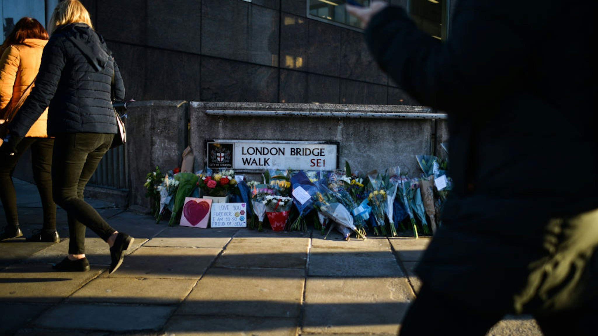 Floral tributes are left for Jack Merritt and Saskia Jones, who were killed in a terror attack, on December 2, 2019 in London, England. Usman Khan, a 28 year old former prisoner convicted of terrorism offences, killed two people in Fishmongers' Hall at the North end of London Bridge on Friday, November 29, before continuing his attack on the bridge. Mr Khan was restrained and disarmed by members of the public before being shot by armed police.