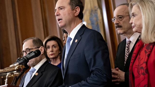 Representative Adam Schiff, a Democrat from California and chairman of the House Intelligence Committee, center, speaks as Representative Jerry Nadler, a Democrat from New York and chairman of the House Judiciary Committee, from left, U.S. House Speaker Nancy Pelosi, a Democrat from California, Representative Eliot Engel, a Democrat from New York and chairman of the House Foreign Affairs Committee, and Representative Carolyn Maloney, a Democrat from New York and chairwoman of the House Oversight Committee, listen during a news conference announcing the next steps in the impeachment inquiry at the U.S. Capitol in Washington, D.C., U.S., on Tuesday, Dec. 10, 2019. House Democrats unveiled two articles of impeachment against President Donald Trump, one on abuse of power and the other involving obstruction of Congress.