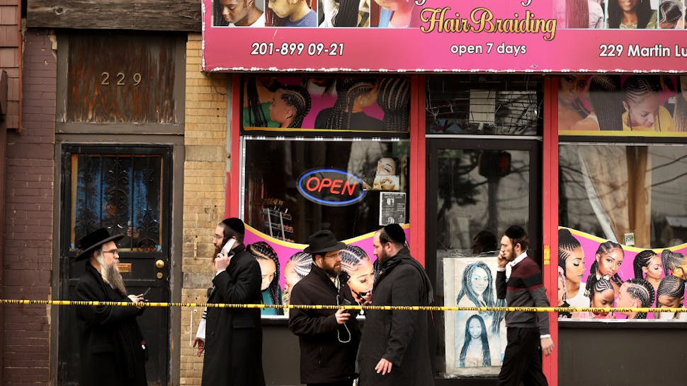 Officials Say Shooting In Jersey City At Kosher Market Was Targeted Attack Members of the Jewish community pass by near the scene of a mass shooting at the JC Kosher Supermarket on December 11, 2019 in Jersey City, New Jersey.