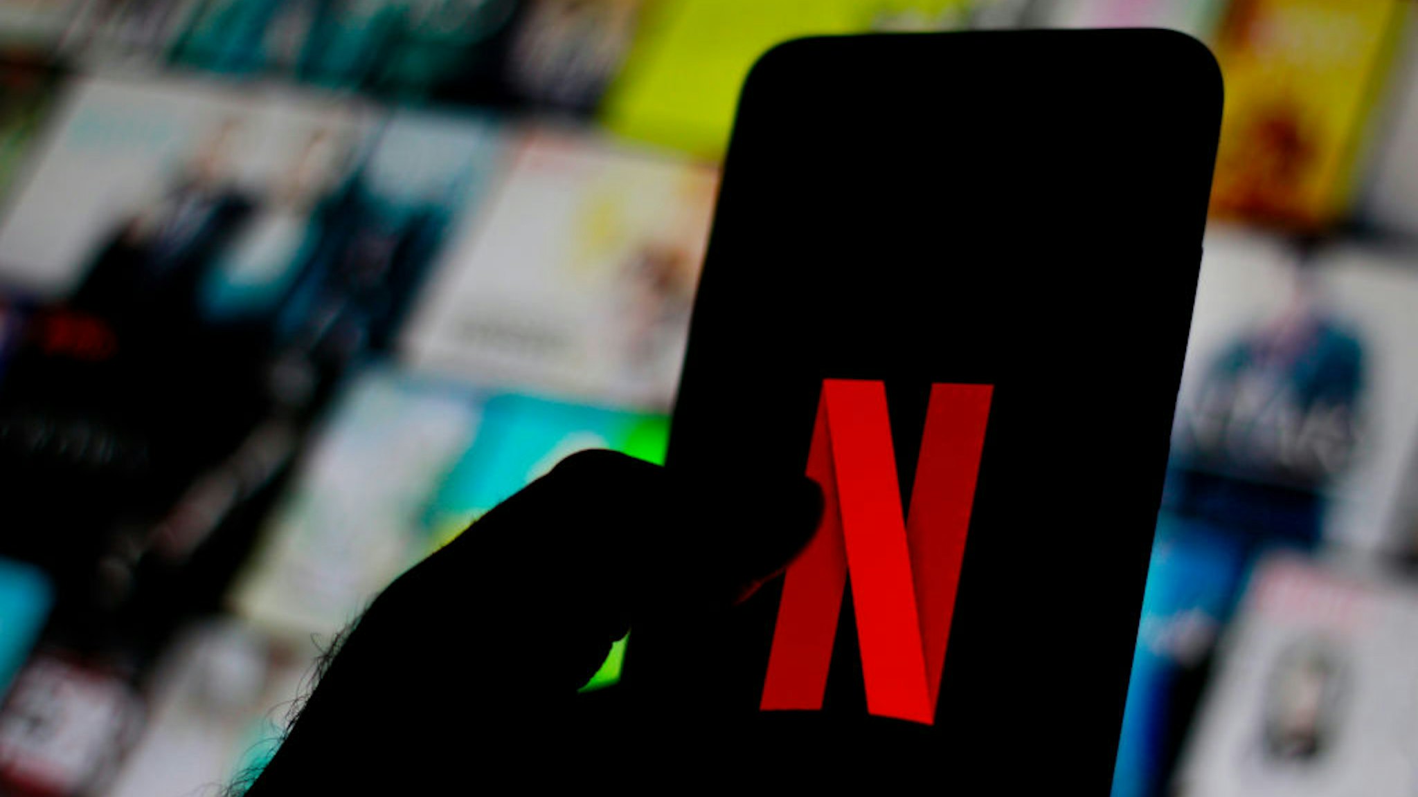 In this photo illustration the Netflix logo is seen displayed on a smartphone.