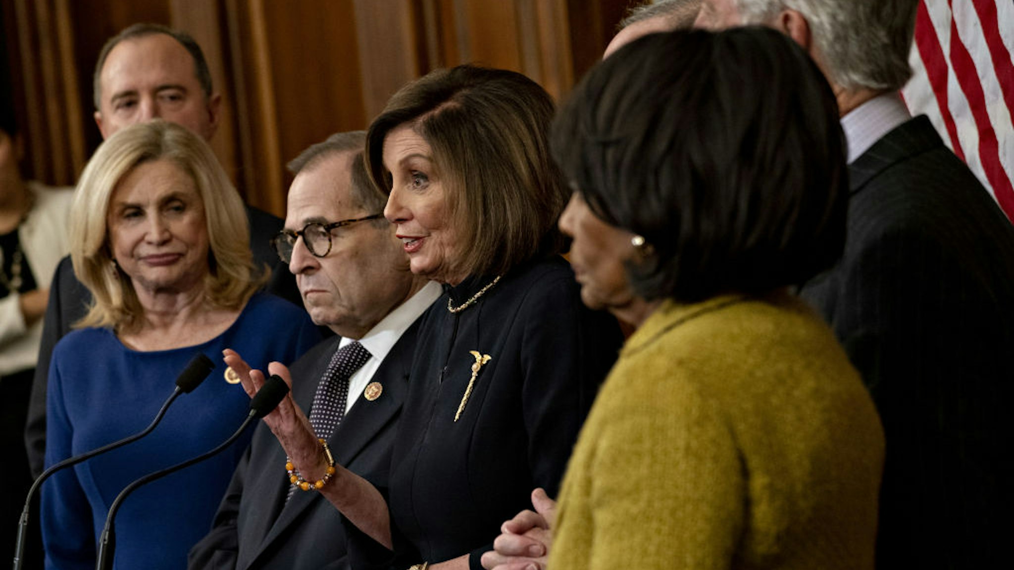 U.S. House Speaker Nancy Pelosi, a Democrat from California, center, speaks during a news conference after the House voted on articles of impeachment against President Donald Trump at the U.S. Capitol in Washington, D.C., U.S., on Wednesday, Dec. 18, 2019.