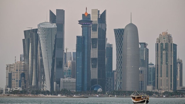A general view taken on December 20, 2019 shows boats moored in front of the skyline of the Qatari capital, Doha.