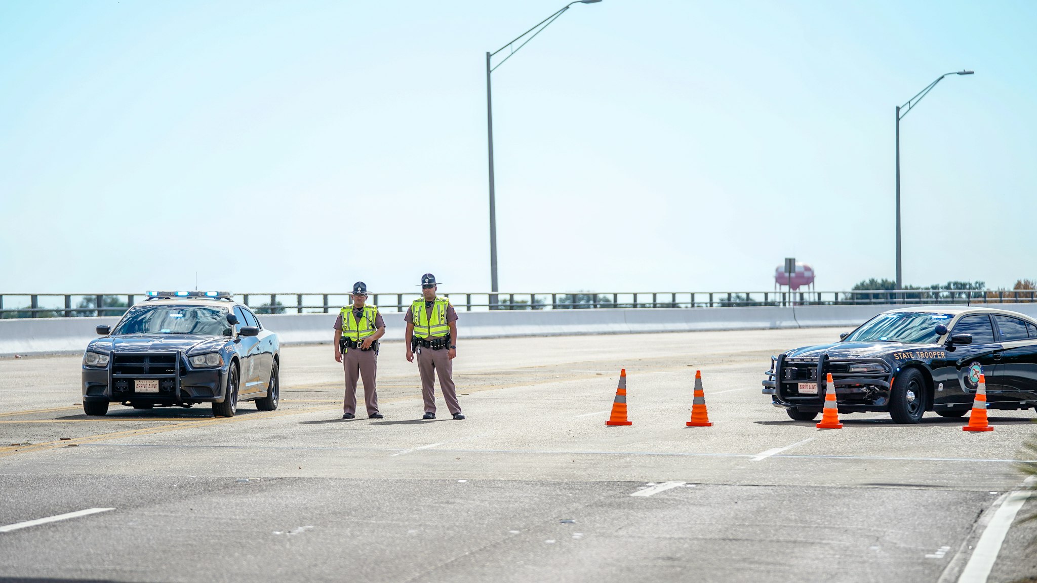 Florida State Troopers block traffic over the Bayou Grande Bridge leading to the Pensacola Naval Air Station following a shooting on December 06, 2019 in Pensacola, Florida. The second shooting on a U.S. Naval Base in a week has left three dead plus the suspect and seven people wounded.