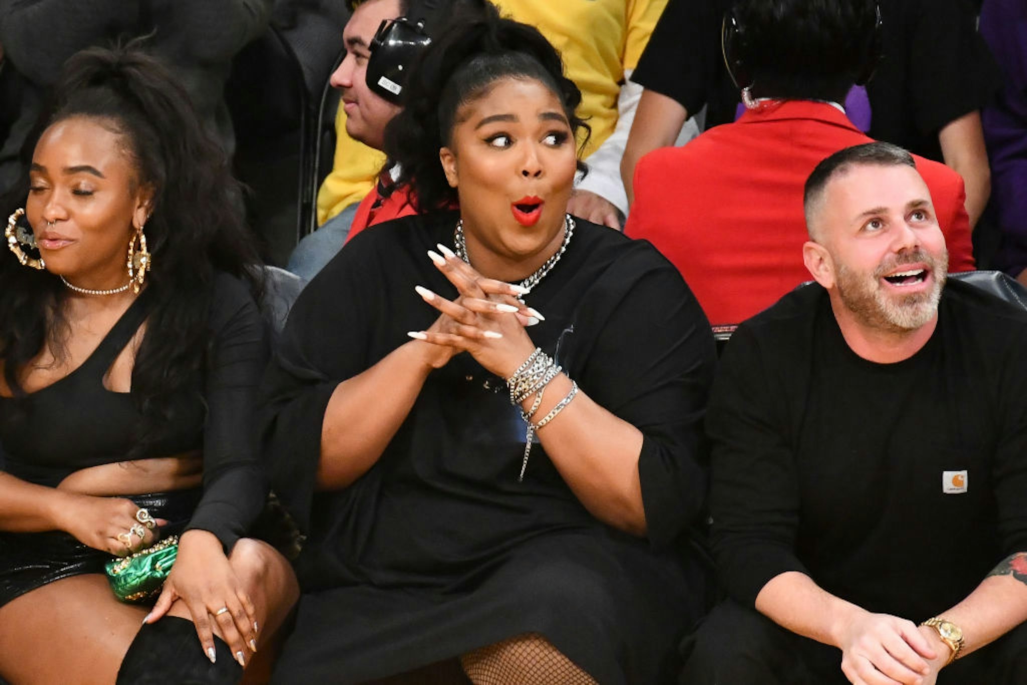 Singer Lizzo (C) attends a basketball game between the Los Angeles Lakers and the Minnesota Timberwolves at Staples Center on December 08, 2019 in Los Angeles, California.