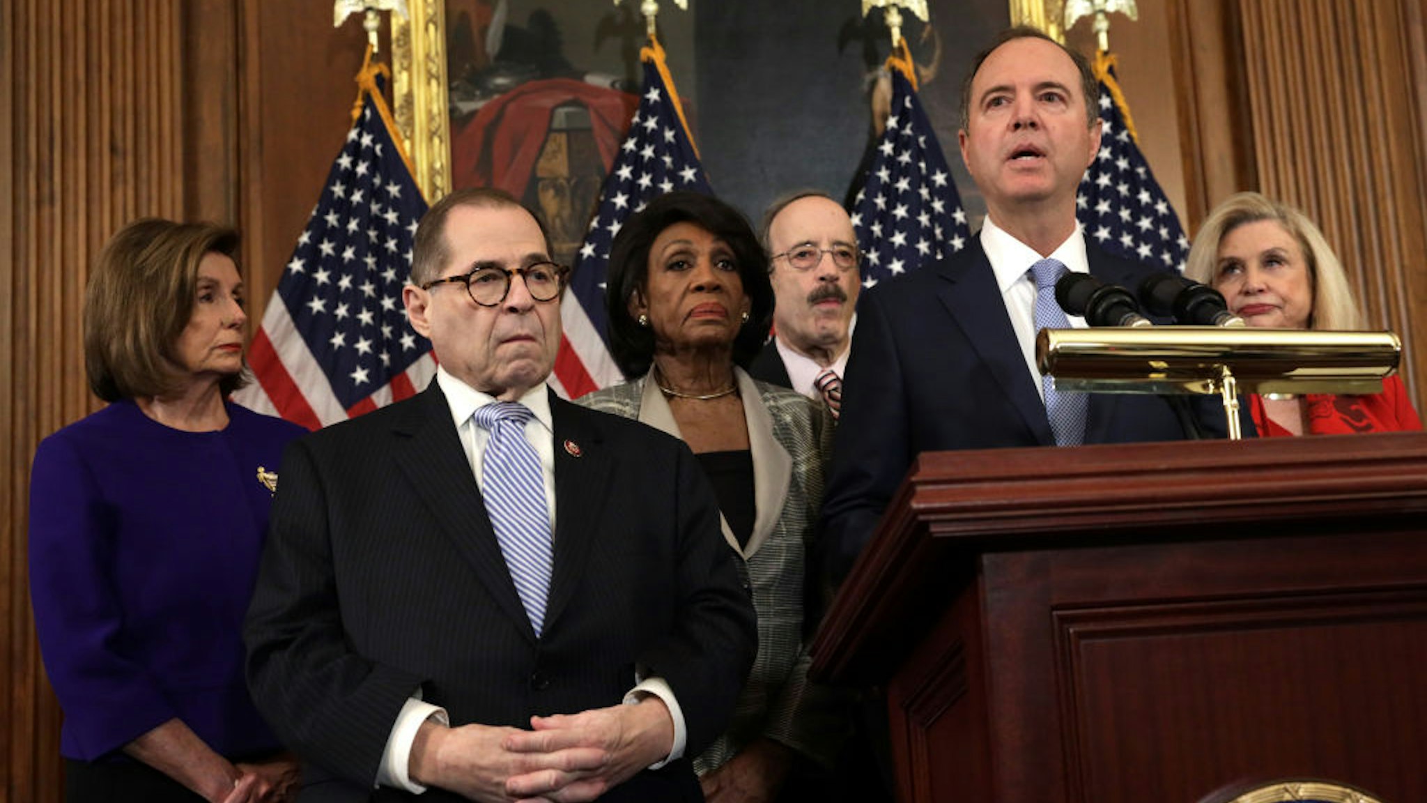 WASHINGTON, DC - DECEMBER 10: Chairman of House Intelligence Committee Rep. Adam Schiff (D-CA) (5th L) speaks as (L-R) Speaker of the House Rep. Nancy Pelosi (D-CA), Chairman of House Judiciary Committee Rep. Jerry Nadler (D-NY), Chairwoman of House Financial Services Committee Rep. Maxine Waters (D-CA), Chairman of House Foreign Affairs Committee Rep. Eliot Engel (D-NY) and Chairwoman of House Oversight and Reform Committee Rep. Carolyn Maloney (D-NY) listen during a news conference at the U.S. Capitol December 10, 2019 in Washington, DC.