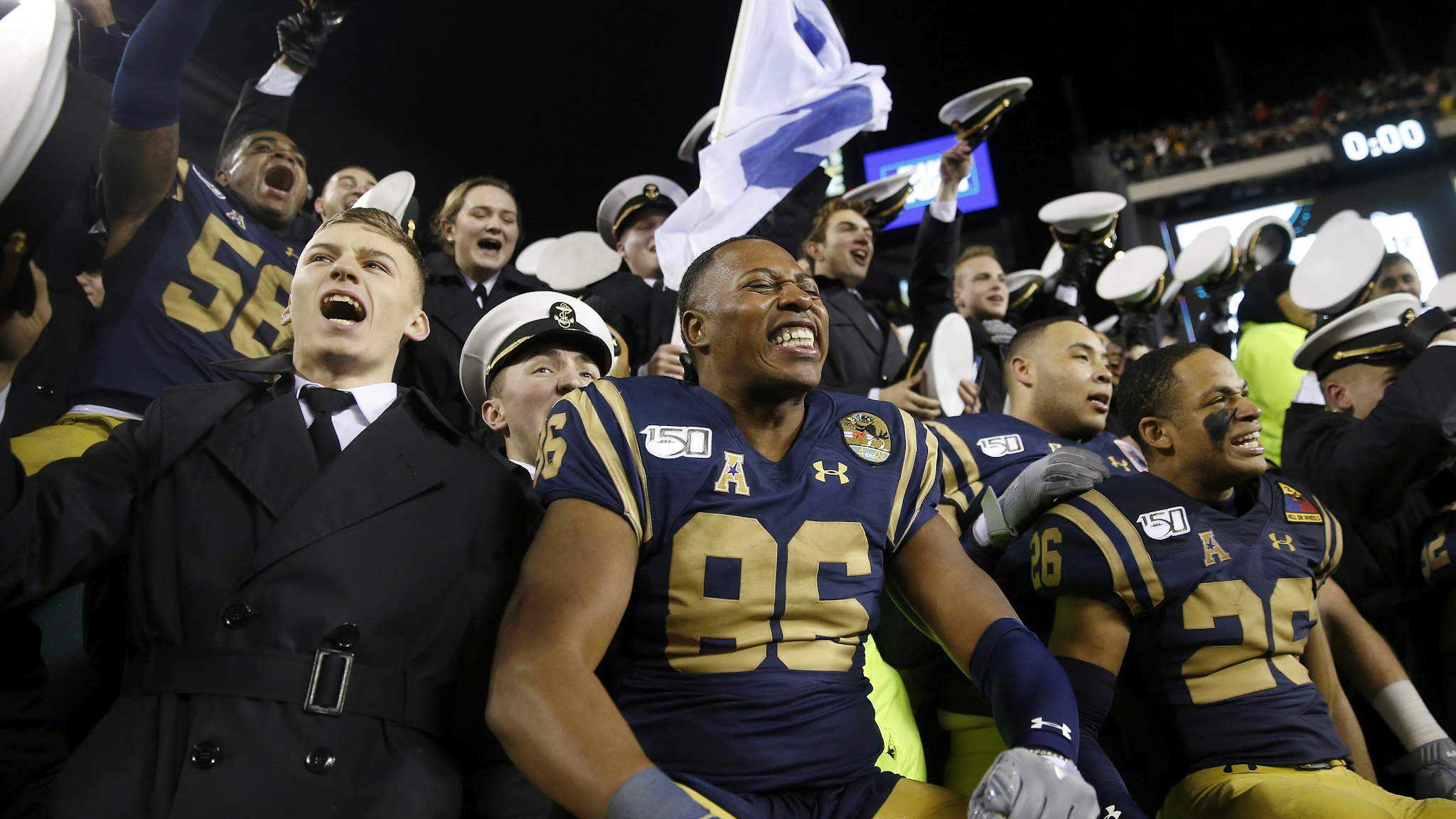 PHILADELPHIA, PENNSYLVANIA - DECEMBER 14: OJ Davis #86 and the rest of the Navy Midshipmen celebrate the win over the Army Black Knights at Lincoln Financial Field on December 14, 2019 in Philadelphia, Pennsylvania.The Navy Midshipmen defeated the Army Black Knights 31-7.