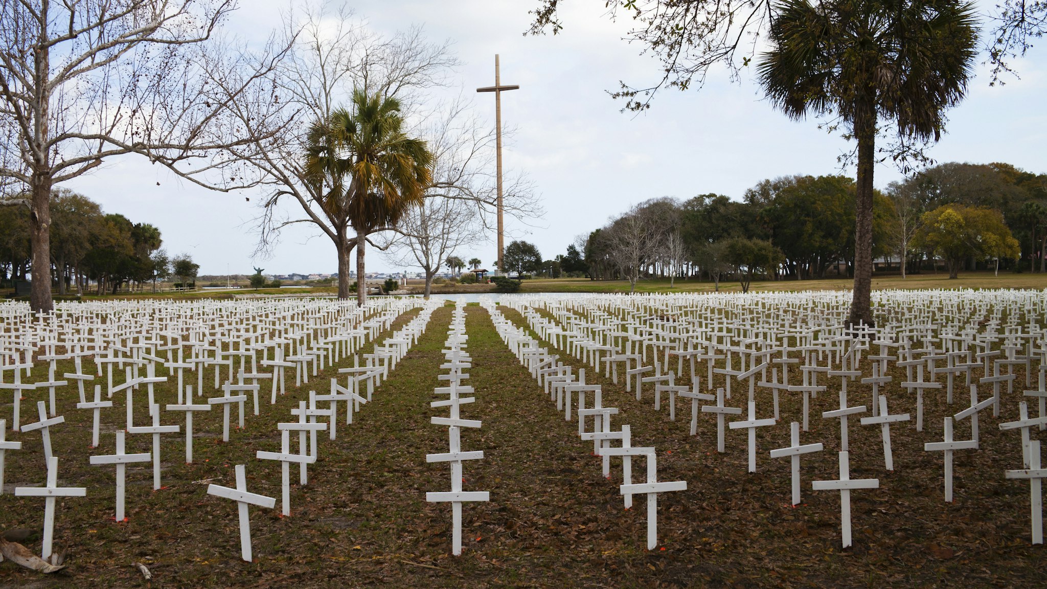 Thousands of white crosses at the Cemetery of the Innocent, in St Augustine, Florida represent the 4000 babies who are aborted daily in the United States. In the background stands the Great Cross, marking where Christianity first came to America.