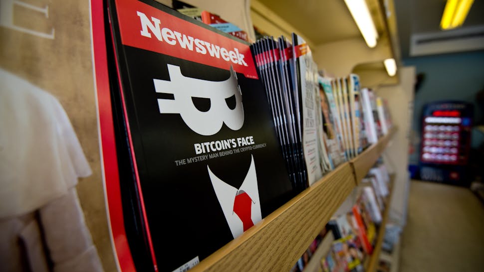 US-MEDIA-NEWSWEEK A copy of the new print edition of Newsweek magazine is diplayed in a newsstand in Washington on March 10, 2014. Newsweek, online only since the end of 2012, returned to print on March 7 in the United States and Europe. Parent company IBT Media is taking a gamble in re-launching the once-iconic news weekly, which has nearly disappeared in the face of serious financial difficulties. In crafting its print resurrection, the New York-based online media group, led by French businessman Etienne Uzac, has adopted a strategy that goes against current practices. The new magazine will seek to position itself as a high-end product, in particular with higher quality paper and printing than its competitors. AFP PHOTO/Nicholas KAMM (Photo credit should read NICHOLAS KAMM/AFP via Getty Images)