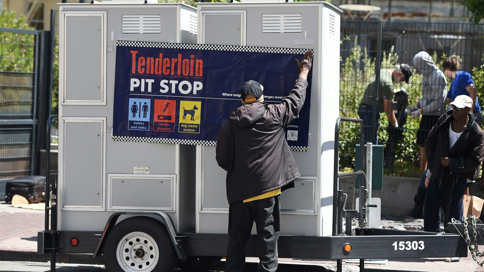 John Leggett helps to install portable toilets in the Tenderloin district of San Francisco, California on Tuesday, June, 28, 2016. The Tenderloin district is commonly known as a hotbed for homelessness where people often relieve themselves on the streets. (Photo by Josh Edelson / AFP) (Photo credit should read JOSH EDELSON/AFP via Getty Images)