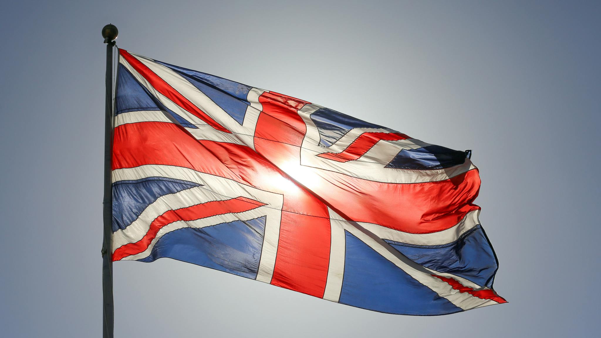 Backlit Union Jack A backlit Union Jack flaps in the wind