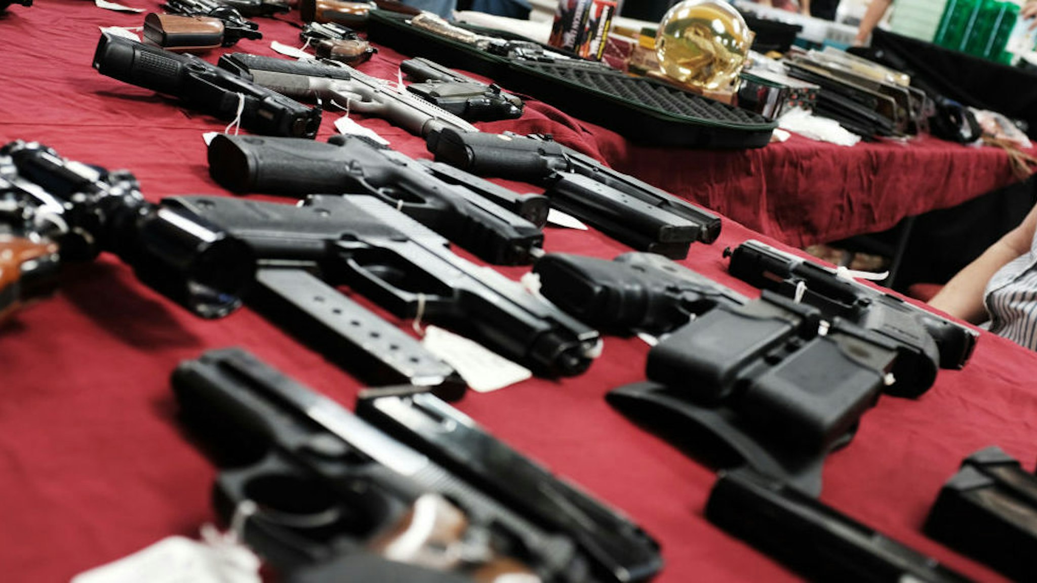 Guns stand for sale at a gun show on November 24, 2018 in Naples, Florida. According to recently released data from the U.S. centers for Disease Control and Prevention, suicides and homicides involving guns have been increasing in America. The report, which faced a large backlash from the gun rights lobby, showed that during the time period between 2015-2016, there were 27,394 homicides involving guns and 44,955 gun suicides in America. (Photo by Spencer Platt/Getty Images)
