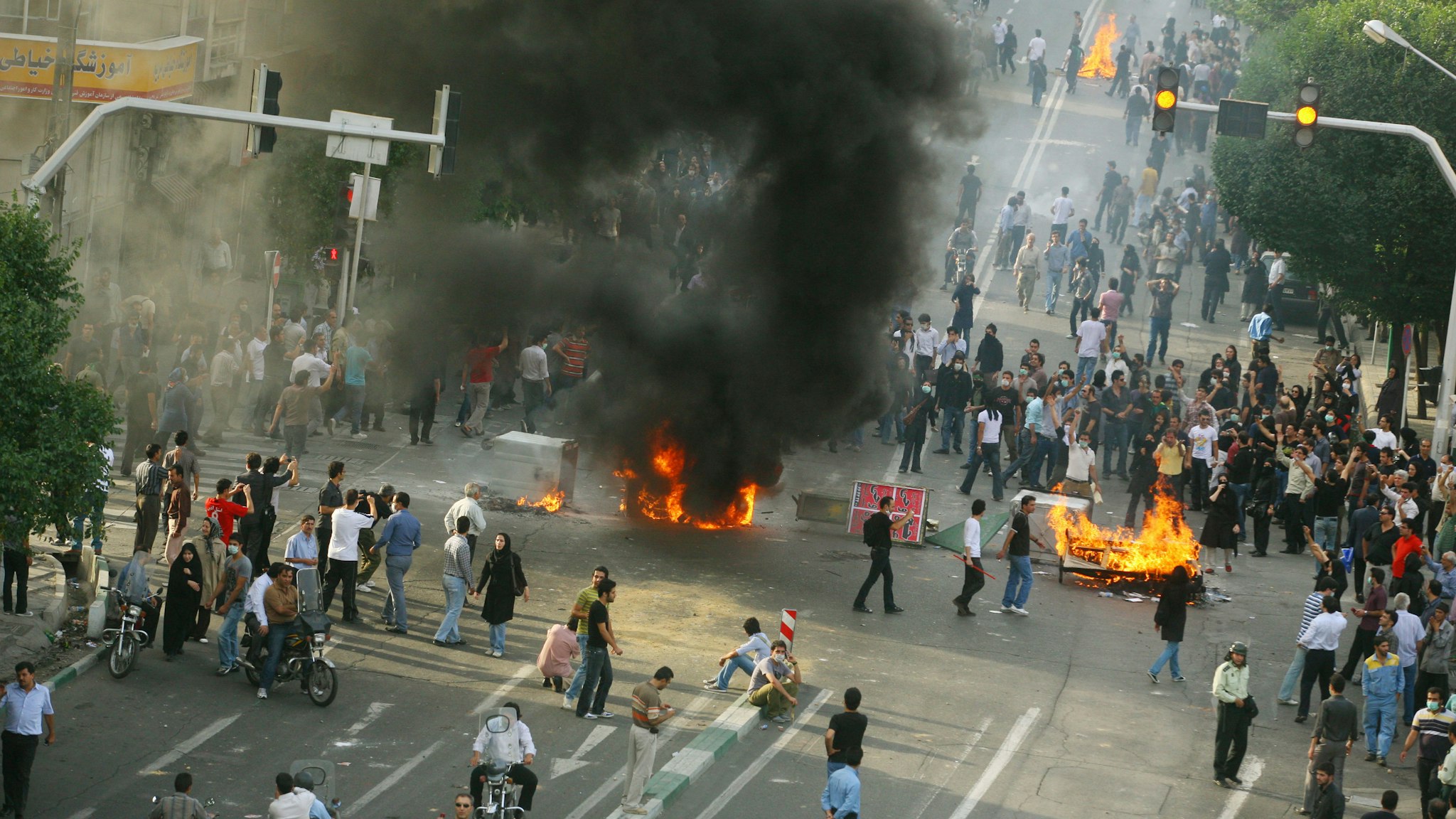 Supporters of Iran's defeated presidential candidate Mir Hossein Mousavi set burning barricades in the streets as they protest during a demonstration on June 20, 2009 in Tehran, Iran. Thousands of Iranians clashed with police as they defied an ultimatum from supreme leader Ayatollah Ali Khamenei calling for an end to protests over last week's disputed presidential election results. Iranian police have tried to break up protest using water cannon, tear gas, batons and live rounds.
