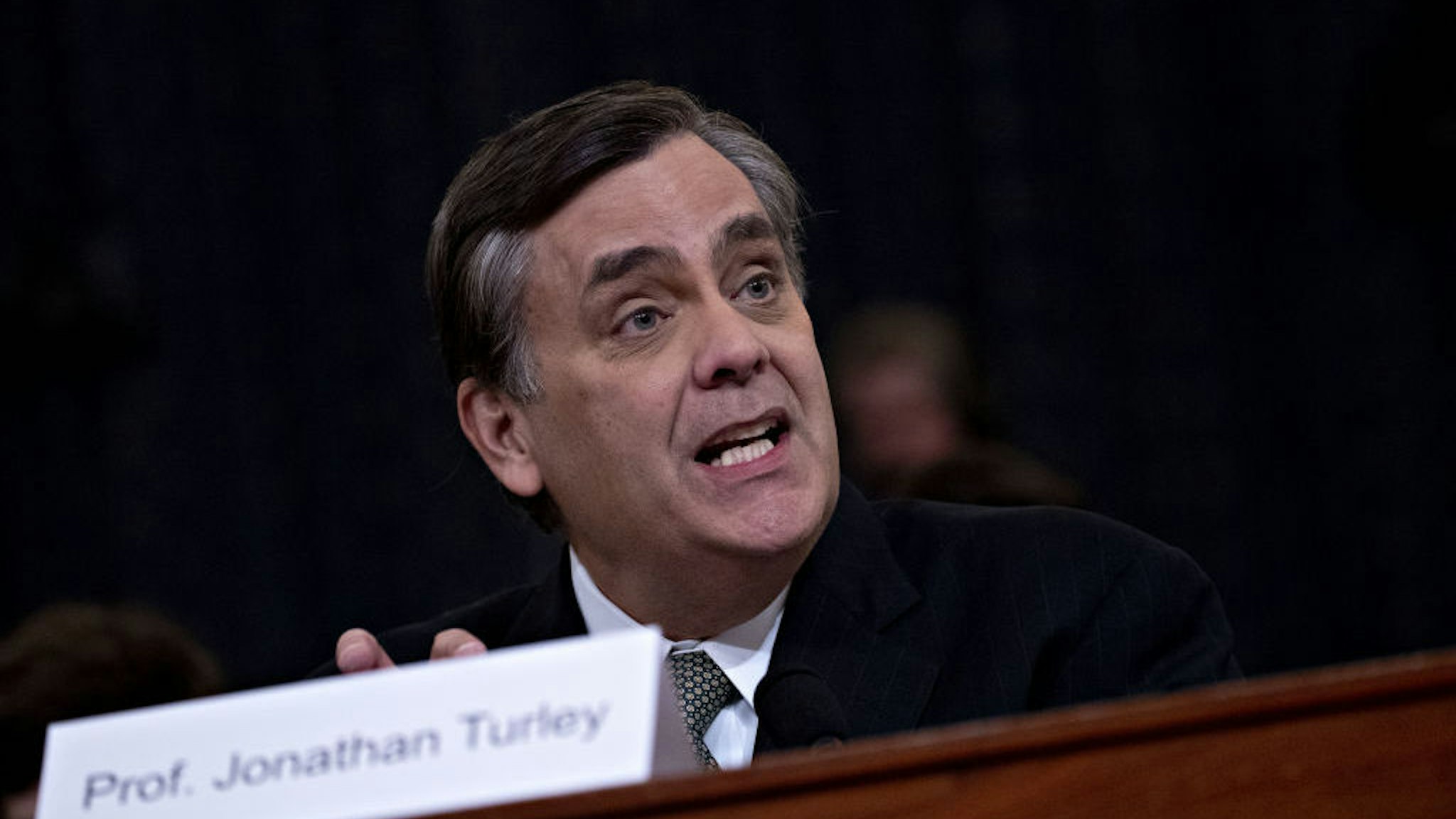 Jonathan Turley, J.B. and Maurice C. Shapiro professor of public interest law at the George Washington University Law School, speaks during a House Judiciary Committee impeachment inquiry hearing in Washington, D.C., U.S., on Wednesday, Dec. 4, 2019. The impeachment of President Donald Trump moves to one of the most polarized committees in Congress where Republicans known for their combativeness will pose a test of the judiciary chairman's ability to keep the proceedings under control. Photographer: Andrew Harrer/Bloomberg