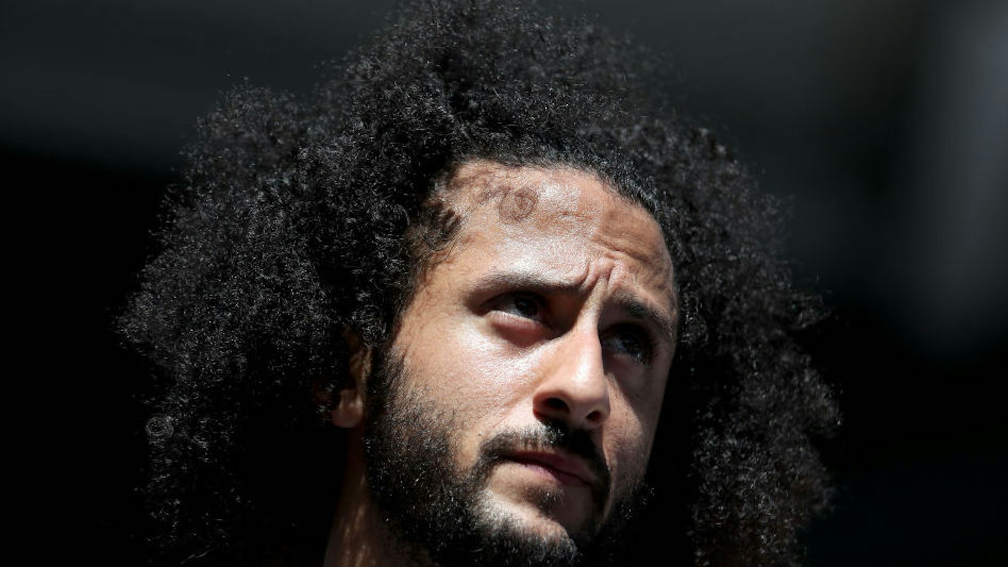 NEW YORK, NEW YORK - AUGUST 29: Former San Francisco 49er Colin Kaepernick watches a Women's Singles second round match between Naomi Osaka of Japan and Magda Linette of Poland on day four of the 2019 US Open at the USTA Billie Jean King National Tennis Center on August 29, 2019 in Queens borough of New York City.