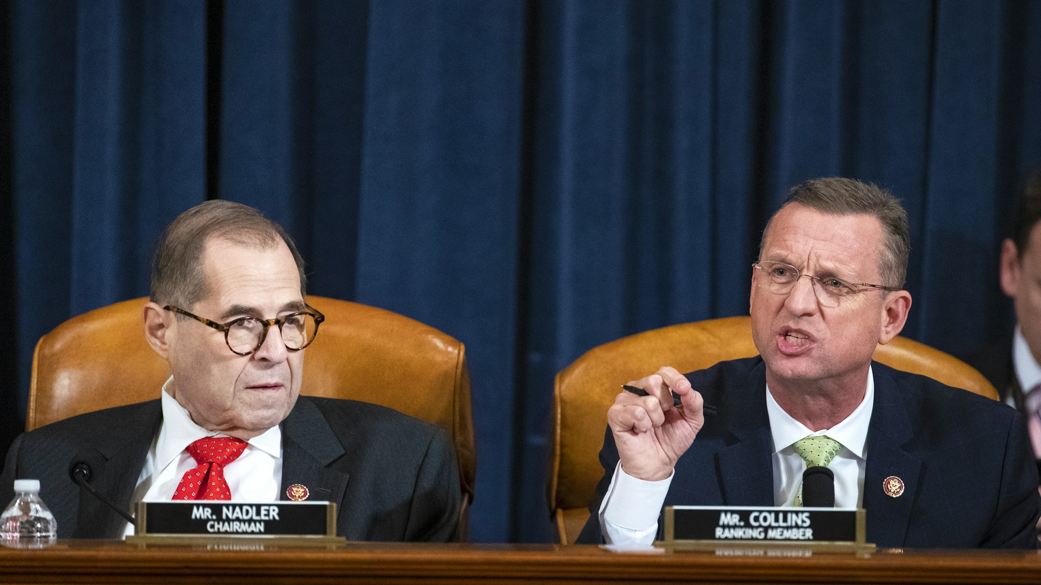 Representative Doug Collins, a Republican from Georgia and ranking member of the House Judiciary Committee, right, speaks while chairman Representative Jerry Nadler, a Democrat from New York, listens during a House Judiciary Committee hearing in Washington, D.C., U.S., on Thursday, Dec. 12, 2019. The Judiciary Committee is set to finish debating articles of impeachment against President Donald Trump today with a likely party-line vote to send the resolution to the floor of the House.