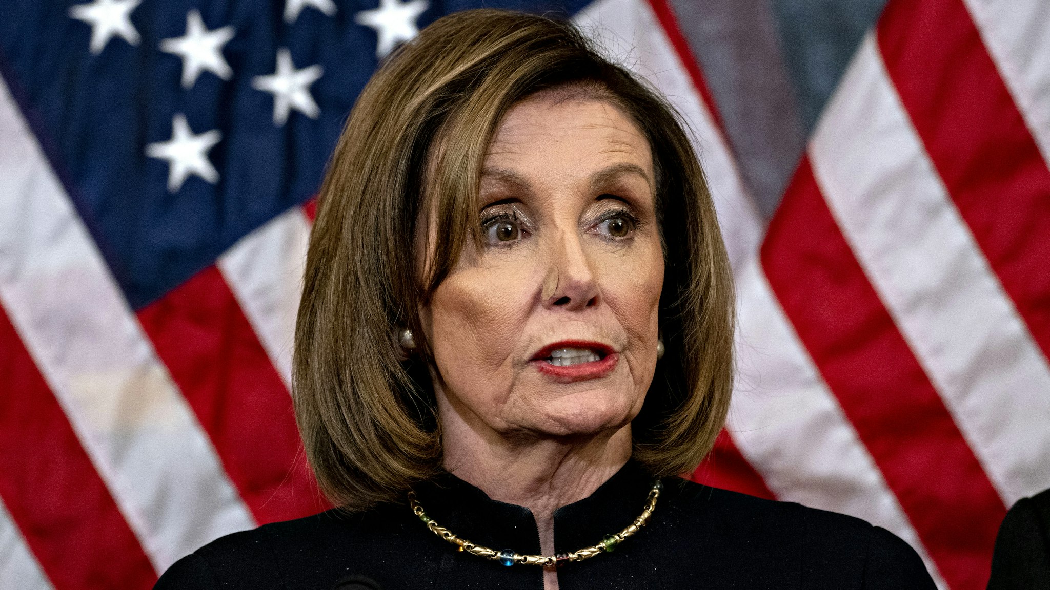 U.S. House Speaker Nancy Pelosi, a Democrat from California, speaks during a news conference after the House voted on articles of impeachment against President Donald Trump at the U.S. Capitol in Washington, D.C., U.S., on Wednesday, Dec. 18, 2019. The U.S. House of Representatives impeached Trump on charges of abuse of power and obstructing Congress, the culmination of an effort by Democrats that further inflamed partisan tensions in Washington and deepened the nations ideological divide.