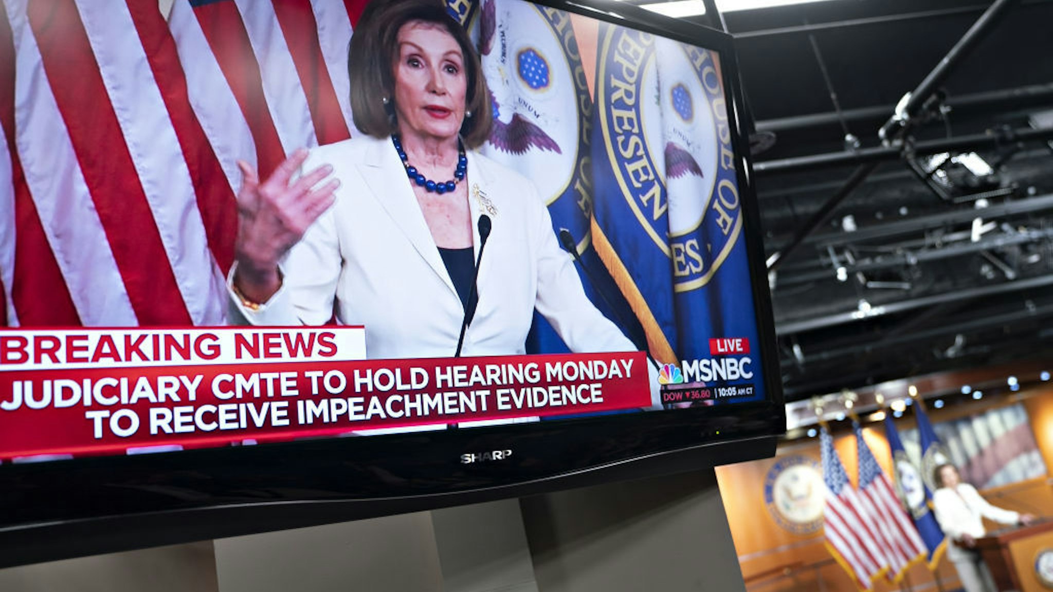 U.S. House Speaker Nancy Pelosi, a Democrat from California, is seen speaking on a television during a news conference on Capitol Hill in Washington, D.C., U.S., on Thursday, Dec. 5, 2019. Pelosi said today that President Donald Trump's actions are a "profound violation of the public trust" and she is asking Representative Jerry Nadler to proceed with drafting articles of impeachment. Photographer: Andrew Harrer/Bloomberg