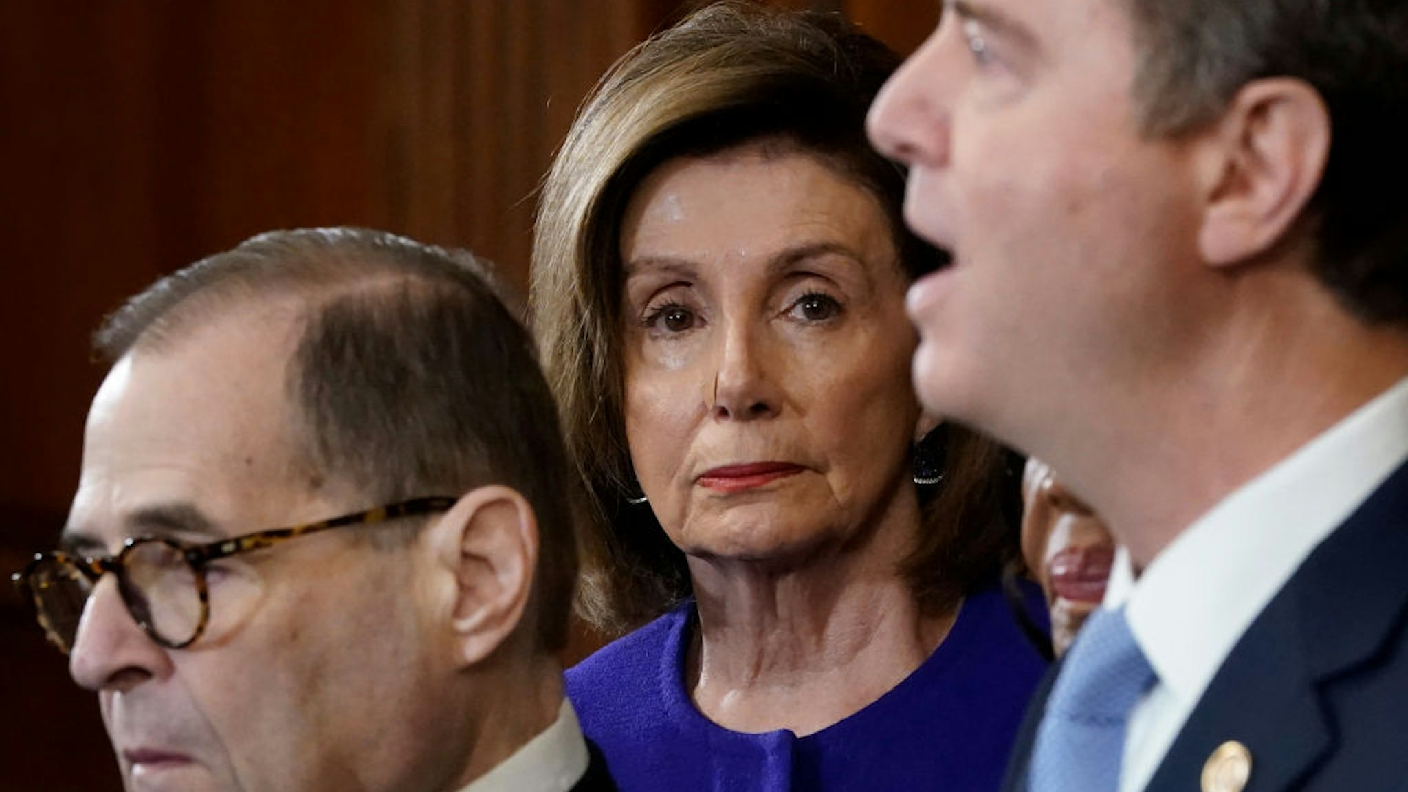 Speaker of the House Nancy Pelosi (D-CA) (C) listens as House investigative committee chairs Rep. Adam Schiff (R) (D-CA) and Rep. Jerry Nadler (L) (D-NY) announce the next steps in the House impeachment inquiry at the U.S. Capitol December 10, 2019 in Washington, DC. The impeachment charges include abuse of power and obstruction claims and ‚Äúclear and present danger‚Äù to national security and the 2020 election. (Photo by Win McNamee/Getty Images)