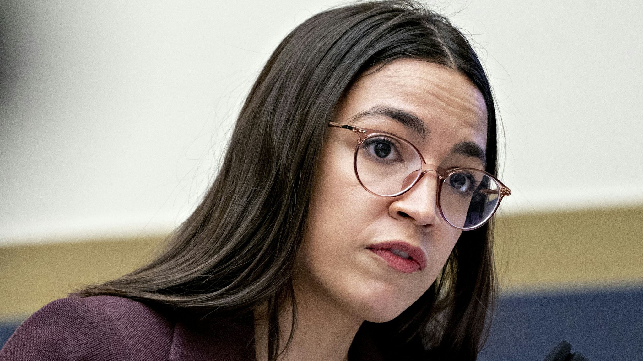 Representative Alexandria Ocasio-Cortez, a Democrat from New York, questions Steven Mnuchin, U.S. Treasury secretary, not pictured, during a House Financial Services Committee hearing in Washington, D.C., U.S., on Thursday, Dec. 5, 2019. Mnuchin said he and the Federal Reserve Chairman dont expect the U.S. to create a digital currency.