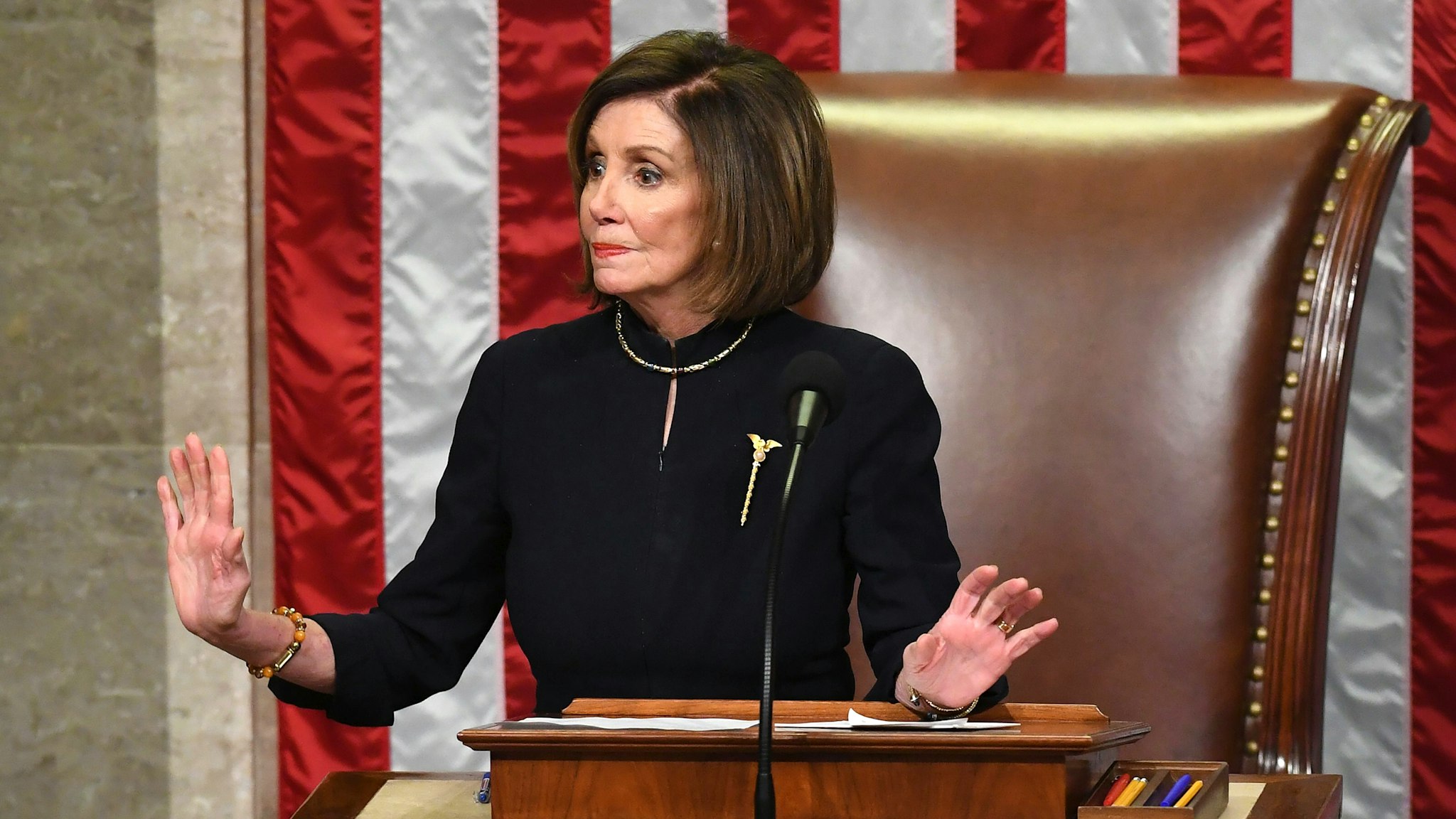 US Speaker of the House Nancy Pelosi presides over Resolution 755, Articles of Impeachment Against President Donald J. Trump as the House votes at the US Capitol in Washington, DC, on December 18, 2019. - The US House of Representatives voted 229-198 on Wednesday to impeach President Donald Trump for obstruction of Congress. The House impeached Trump for abuse of power by a 230-197 vote. The 45th US president is just the third occupant of the White House in US history to be impeached.