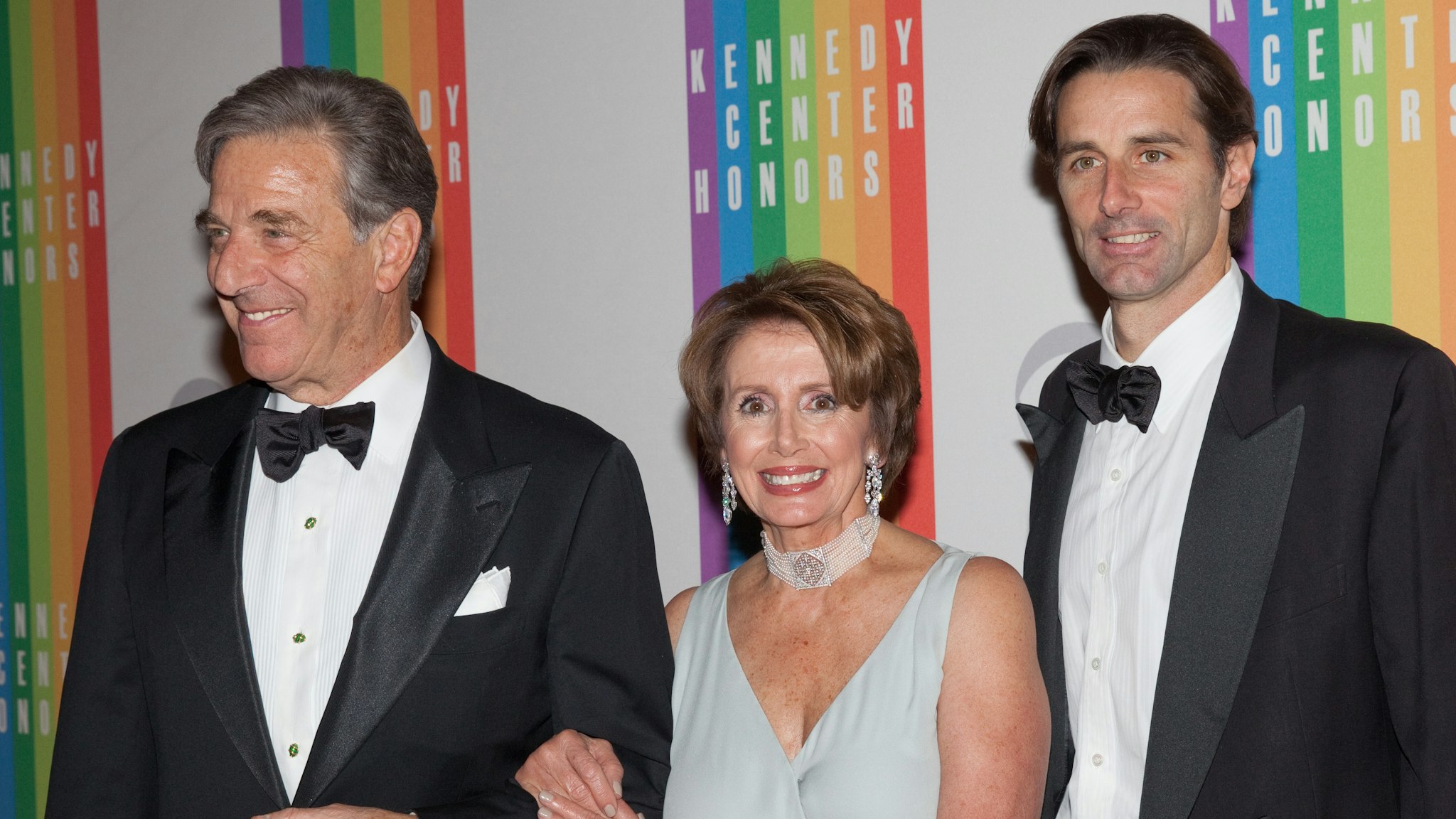 House Minority Leader Nancy Pelosi (C) arrives with her husband Paul Pelosi (L) and son Paul Pelosi, Jr. at the 35th Kennedy Center Honors, at the Kennedy Center in Washington, DC, December 2, 2012.