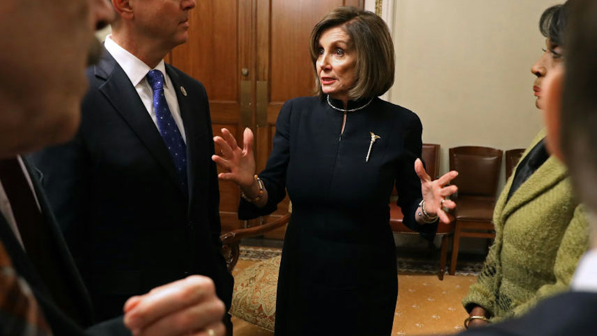 WASHINGTON, DC - DECEMBER 18: Speaker of the House Nancy Pelosi (D-CA) (C) meets with committee chairs, including Foreign Affairs Committee Chairman Eliot Engel (D-NY) (L) and Intelligence Committee Chairman Adam Schiff (D-CA) immediately following votes on articles of impeachment of U.S. President Donald Trump in Pelosi's ceremonial office at the U.S. Capitol December 18, 2019 in Washington, DC. The U.S. House of Representatives voted to successfully pass two articles of impeachment against President Donald Trump on charges of abuse of power and obstruction of Congress.
