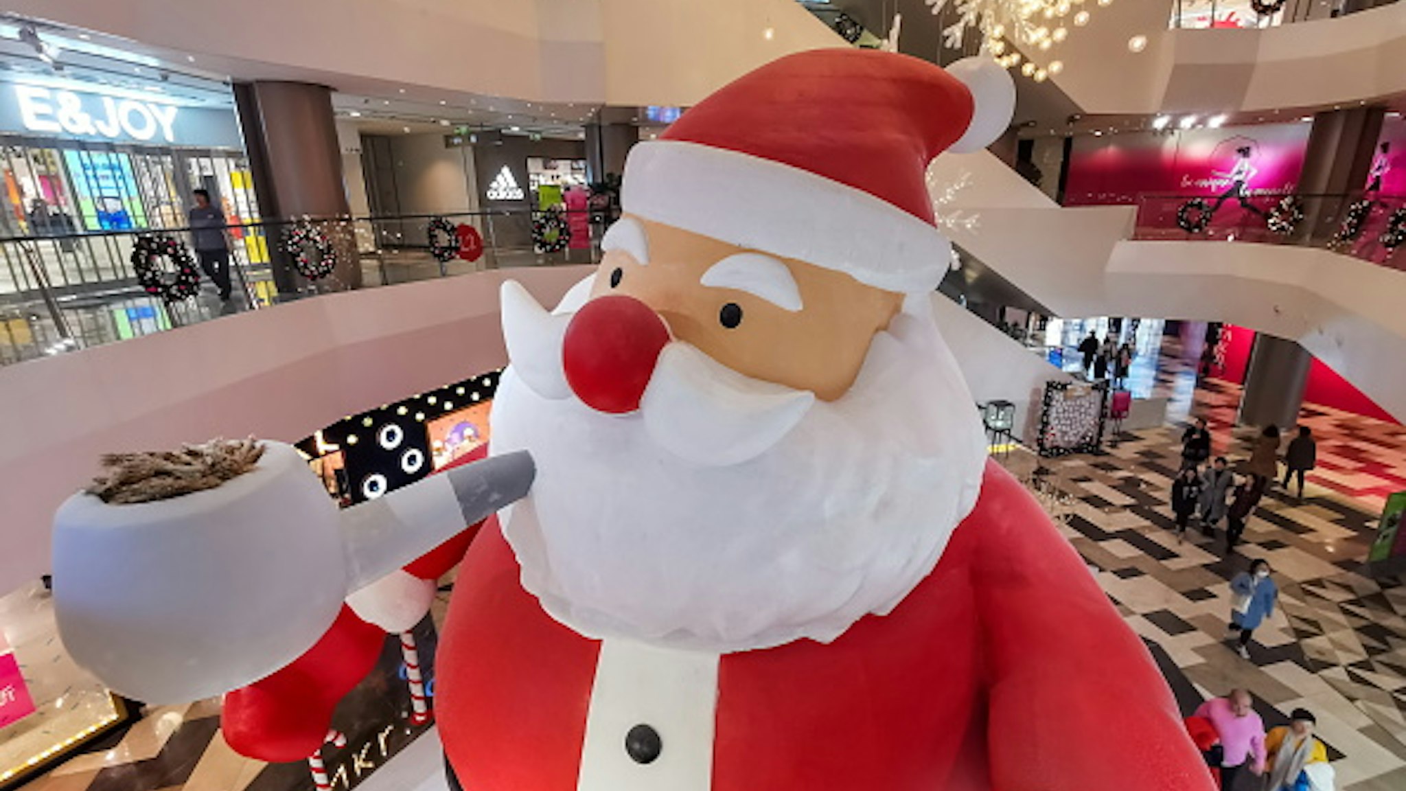 SHANGHAI, CHINA - DECEMBER 10, 2019 - A 9-meter-high "Santa Claus" is set up in the mall, Shanghai, China, December 10, 2019.- PHOTOGRAPH BY Costfoto / Barcroft Media