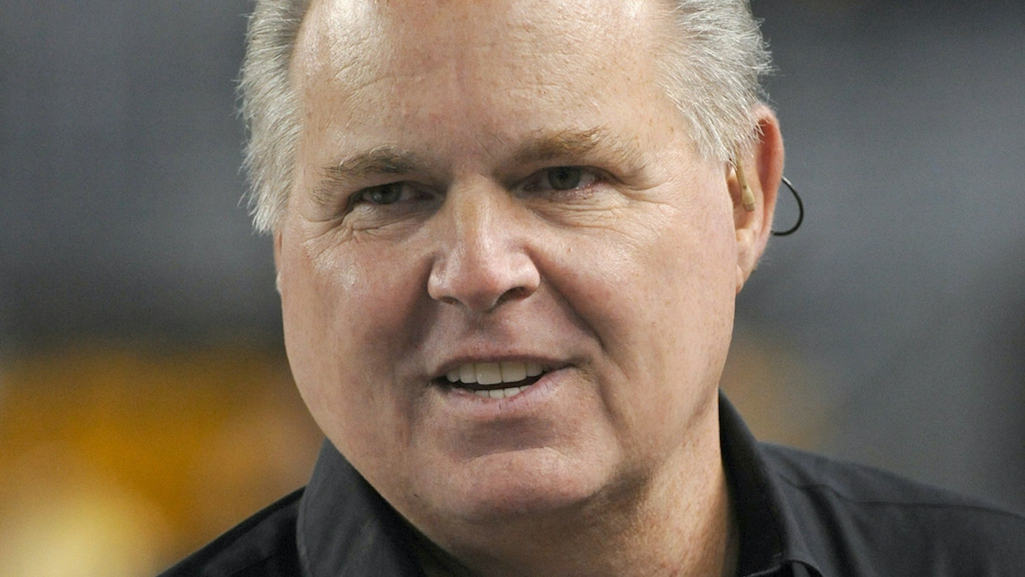 Radio talk show host and political commentator Rush Limbaugh looks on from the sideline before a National Football League game between the New England Patriots and Pittsburgh Steelers at Heinz Field on November 14, 2010 in Pittsburgh, Pennsylvania. The Patriots defeated the Steelers 39-26. (Photo by George Gojkovich/Getty Images)