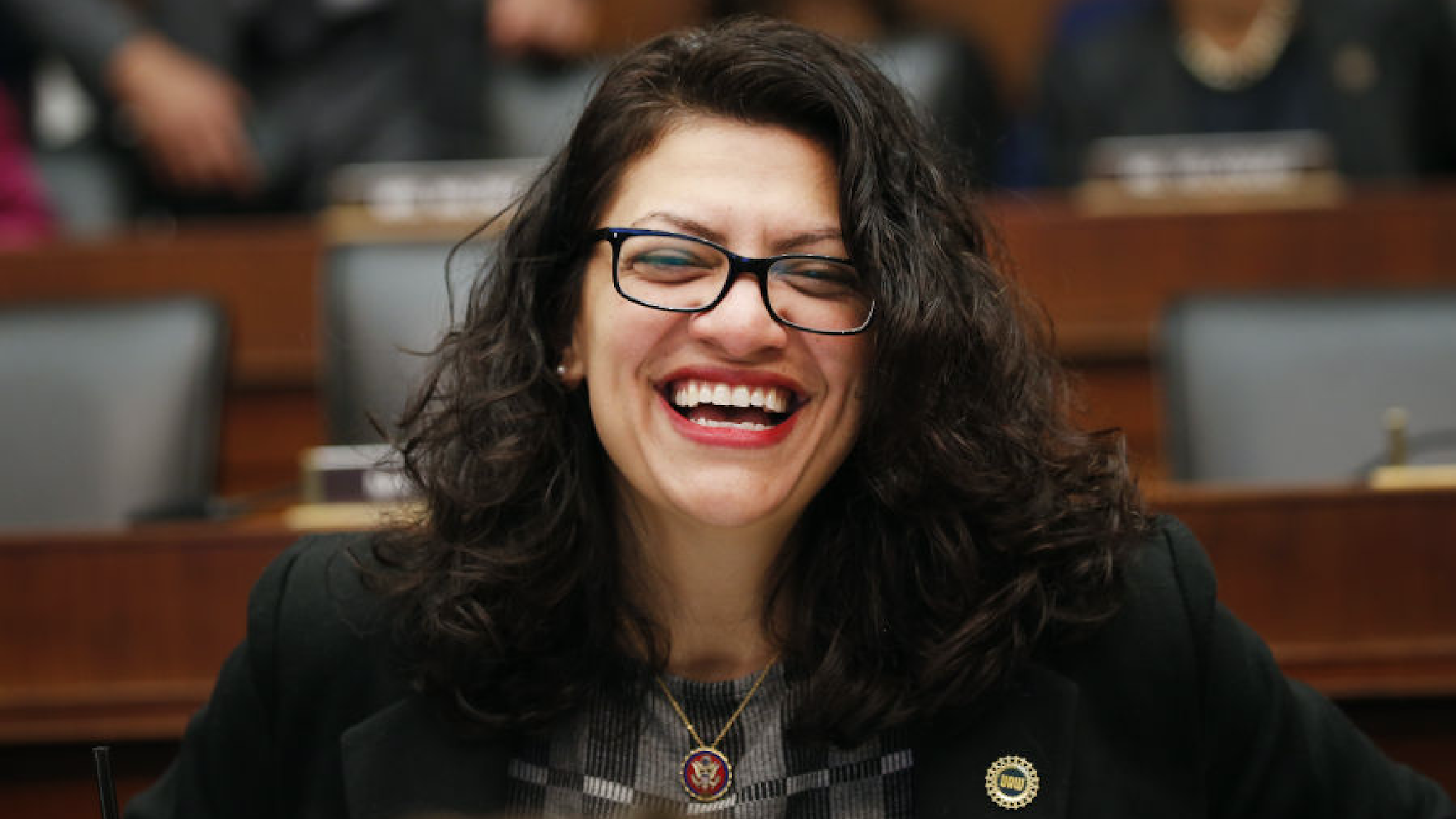 Representative Rashida Tlaib, a Democrat from Michigan, smiles before the start of a House Financial Services Committee hearing with Mark Zuckerberg, chief executive officer and founder of Facebook Inc., in Washington, D.C., U.S., on Wednesday, Oct. 23, 2019.