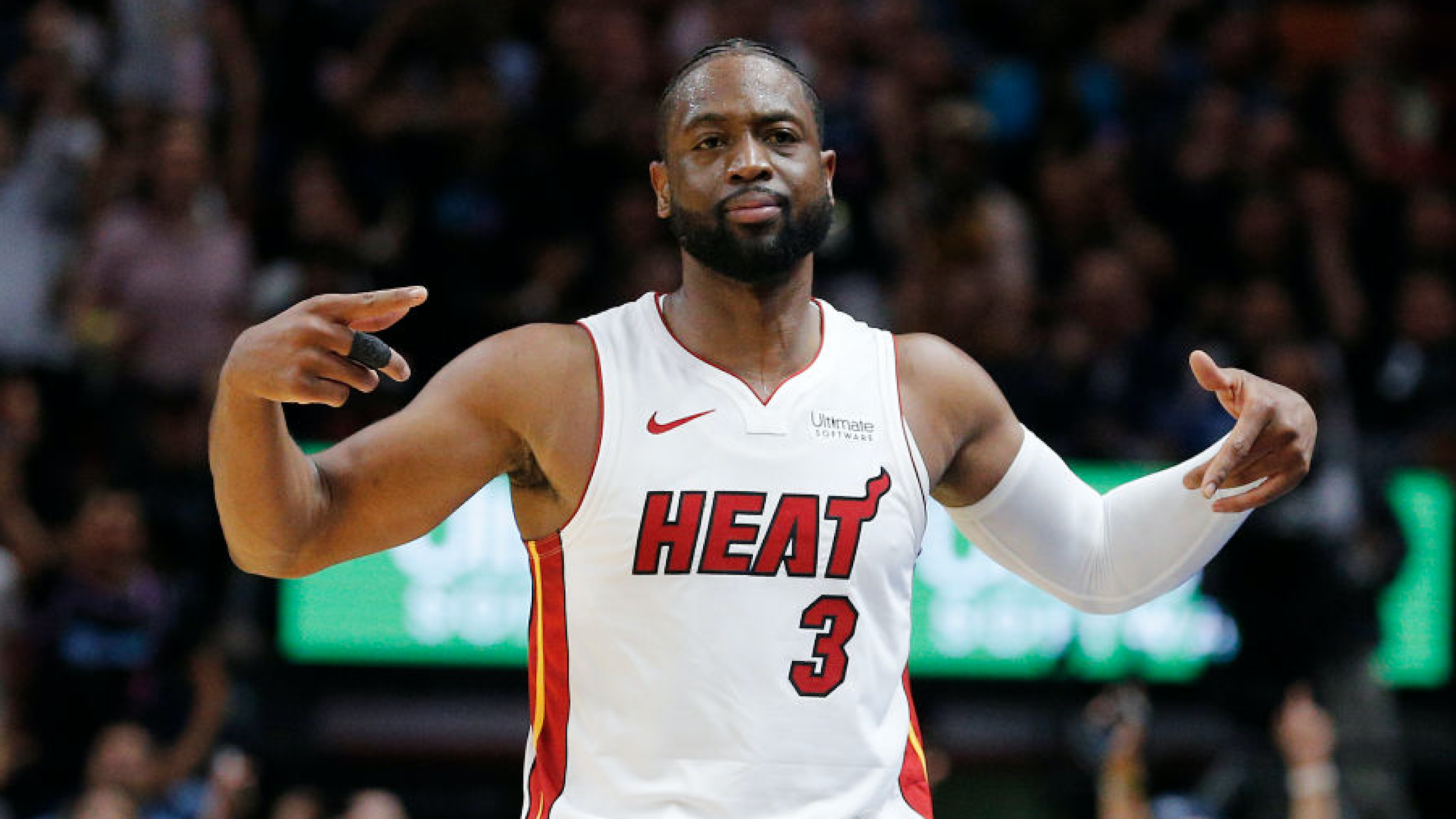 Dwyane Wade #3 of the Miami Heat reacts after hitting a three pointer against the Philadelphia 76ers during the second half at American Airlines Arena on April 09, 2019 in Miami, Florida.