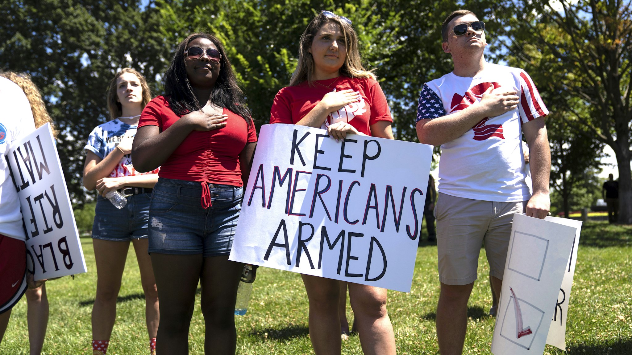 People sing the national anthem during the March For Our Rights rally, promoting Second Amendment Rights and the safety of students in schools outside the U.S. Capitol on July 7, 2018 in Washington, DC. Rallies are being held across the country as a reaction to the student-led gun control movement started after the Parkland school shooting.