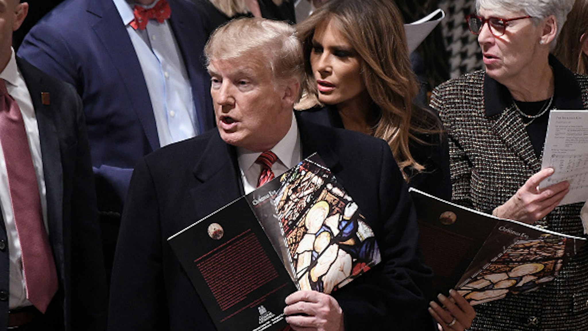 WASHINGTON, DC - DECEMBER 24: U.S. President Donald Trump and first lady Melania Trump attend Christmas Eve services at the National Cathedral on December 24, 2018 in Washington, D.C.