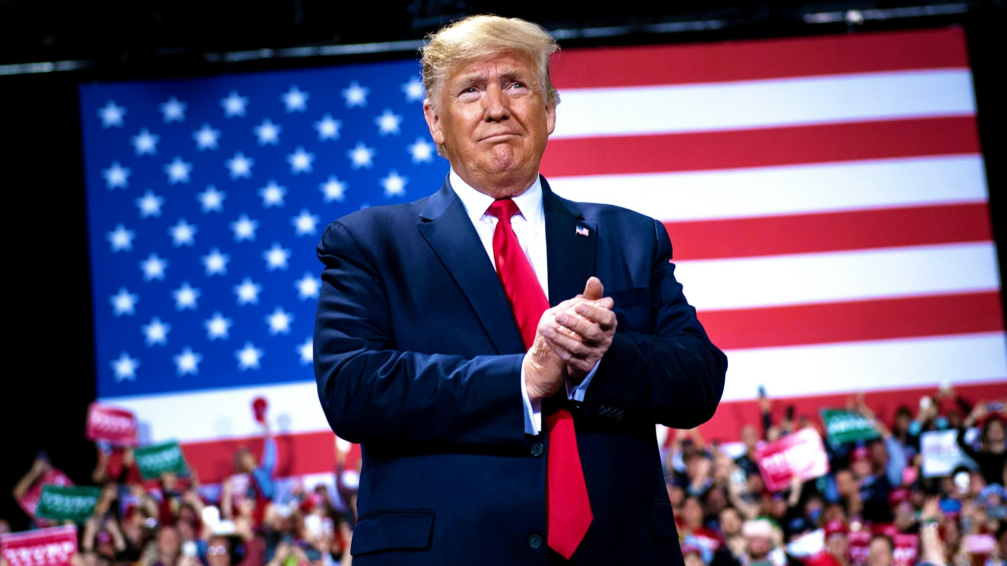 US President Donald Trump gestures during a Keep America Great Rally at Kellogg Arena December 18, 2019, in Battle Creek, Michigan.