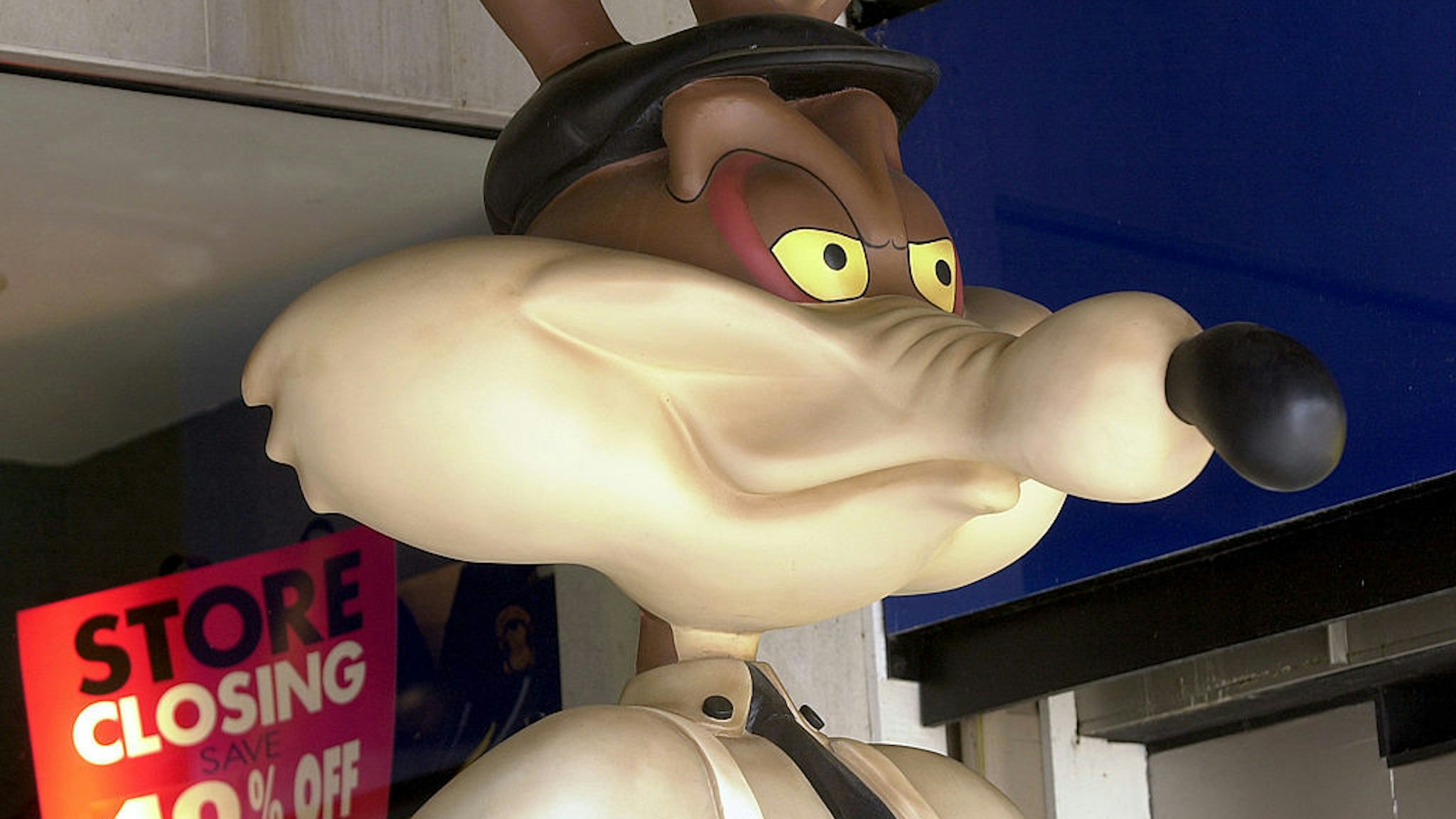 A statue of cartoon character Wile E. Coyote is displayed outside of a Warner Bros. Studio Store July 9, 2001 on Pier 39 in San Francisco, CA . AOL Time Warner Inc. will close its U.S. based Warner Bros. Studio Stores by the end of October, with a loss of 3,800 jobs, after failing to find a buyer for the chain, a company spokeswoman said. (Photo by Justin Sullivan/Getty Images)