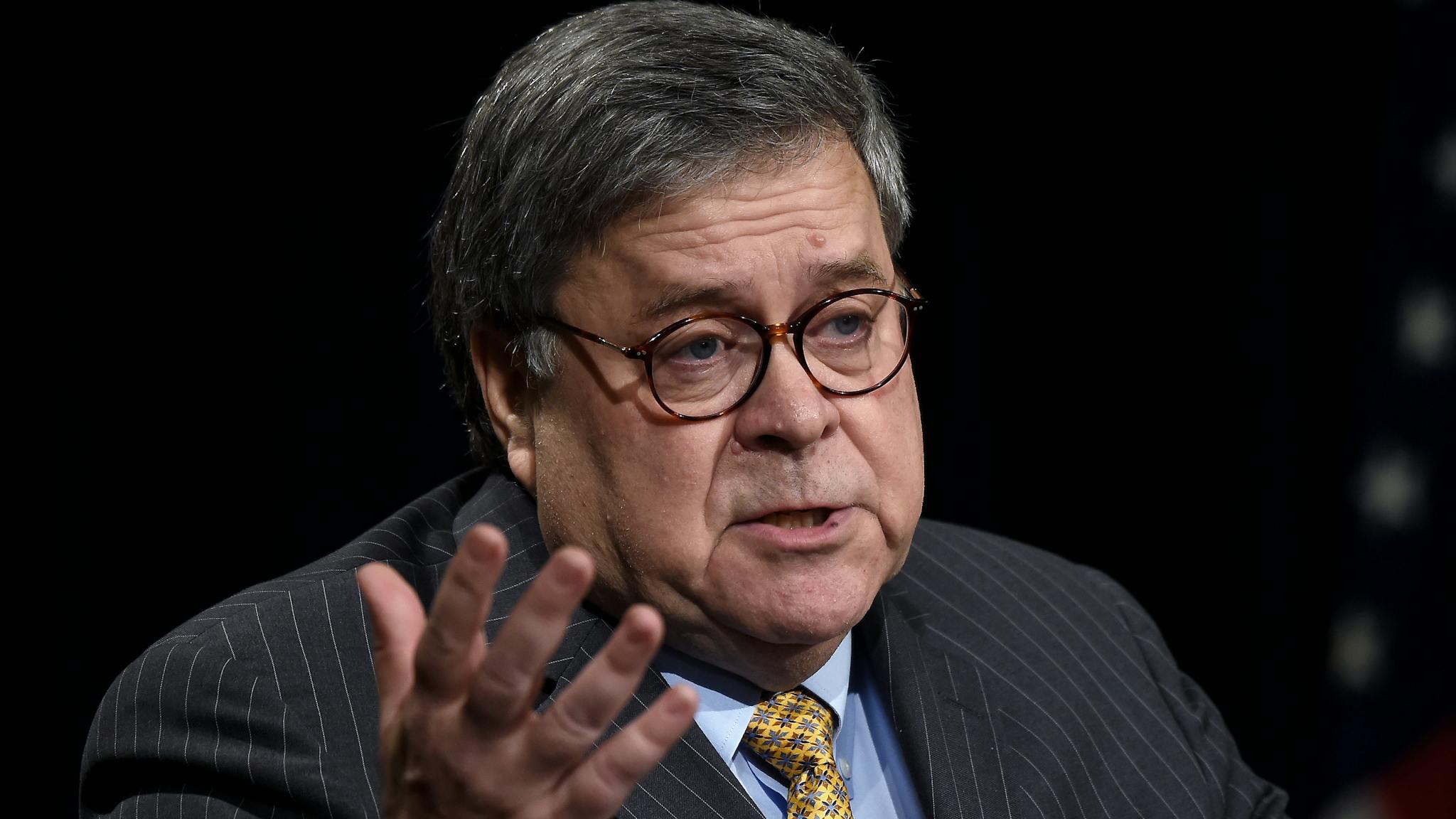 William Barr US Attorney General William Barr participates in an awards ceremony for 19 law enforcement officers for their efforts in criminal investigations, field operations and innovations in community policing, in the Great Hall of the Justice Department in Washington, DC on December 3, 2019.
