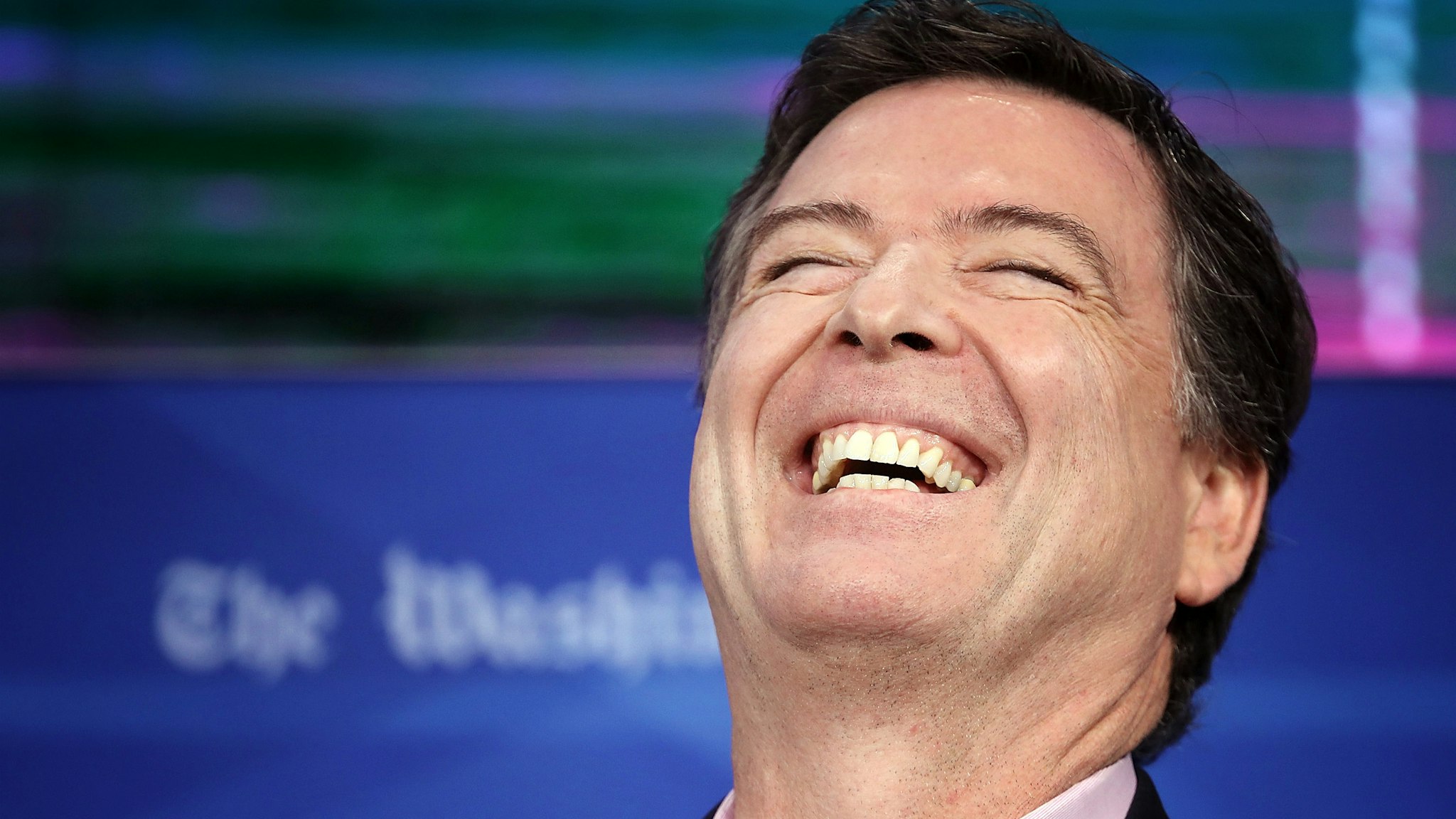 WASHINGTON, DC - MAY 07: Former FBI director James Comey laughs while answering questions during an interview forum at the Washington Post May 8, 2018 in Washington, DC. Comey discussed his stormy tenure as head of the FBI, his handling of the Hillary Clinton email investigation, his tense relationship with President Trump and his controversial firing a year ago, during the forum.