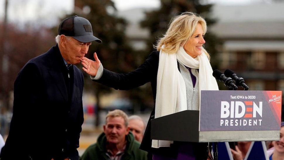 Democratic presidential candidate, former Vice President Joe Biden bites the finger of his wife Jill Biden as she introduces him during a campaign event on November 30, 2019 in Council Bluffs, Iowa. Biden, who begins his eight-day bus tour across Iowa on Saturday, once lead the state in the polls but now trails presidential candidates Pete Buttigieg and Elizabeth Warren with just under 3 months until the 2020 Iowa Democratic caucuses.