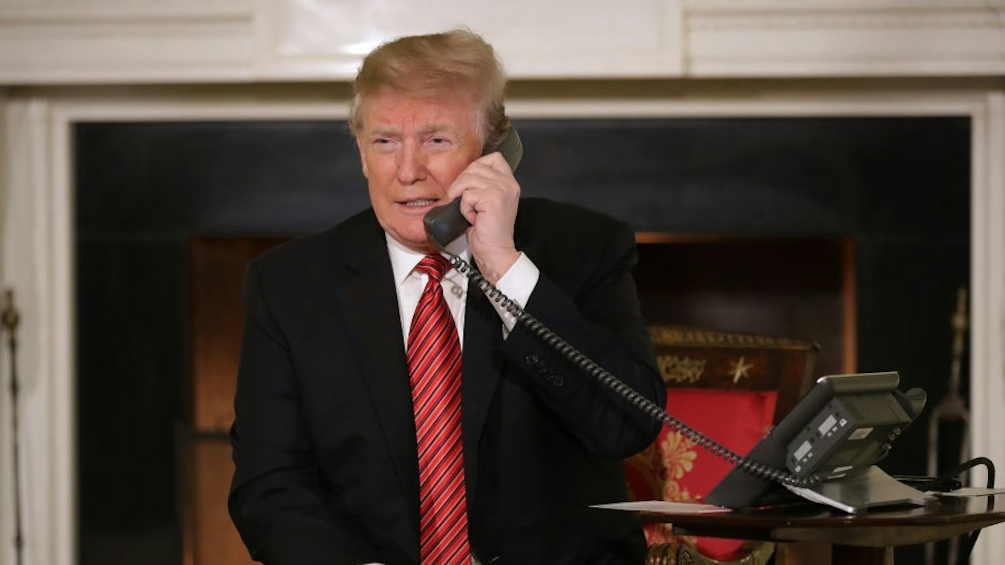 U.S. President Donald Trump takes phone calls from children as he participates in tracking Santa Claus' movements with the North American Aerospace Defense Command (NORAD) Santa Tracker on Christmas Eve in the East Room of the White House December 24, 2018 in Washington, DC. This is the 63rd straight year that NORAD has publicly tracked Santa’s sleigh on its global rounds.
